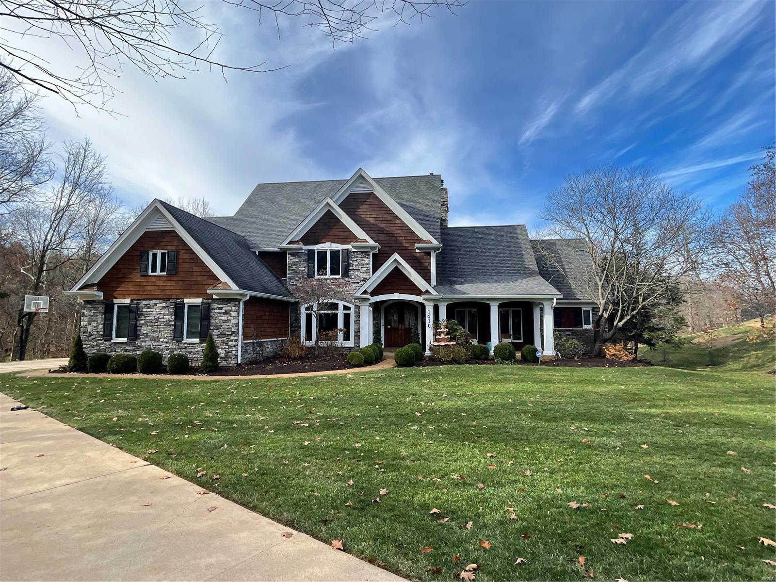 Spectacular 1.5-Story, private retreat, tucked away on a quiet cul-de-sac street, has 6 Bedrooms, 7 Baths (5 full / 2 half) & 6700+ Sqft of living space including the awesome finished Lower Level! Meticulously maintained inside & out, painted in stylish, neutral colors making this home truly move-in ready. Upon entering through the handcrafted front doors, you’ll know you’re home! Highlights: newer roof, gutters & downspouts (2013), newer cedar siding (2013) & recently re-stained (2021), refinished hardwood floors (2021), newer carpet (2020), newer 3-zoned HVAC (2017-2020), professionally landscaped yard w/multi-zone irrigation system, landscape lighting & oversized 3-car, side entry garage - just to name a few. Relax outside in your own private oasis, boasting a gorgeous inground pool w/water features & built-in spa, large pool deck (resurfaced December 2021) w/multiple seating areas & built-in fire pit - perfect for entertaining family & friends! Top Rated Rockwood School District!