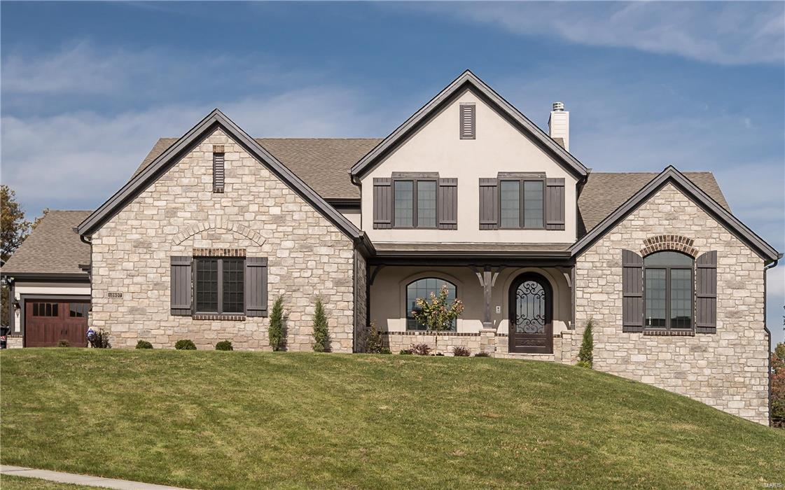 Elegant living at its finest,location,functionality & exquisite finishes throughout.This gorgeous 1.5 story Bellerive model features 5 bedrooms, 4.5 bath w/over 6,000 sq ft of living space & elevation unique to sought-after community at the Arbors.Expansive flagstone porches, brick & stone, extended driveways,OS garages,family foyer w/built-in nooks & bench & arched wrought iron 500# entry door just to start.7in white oak plank floors flow through to box beamed great room w/grand stone surround FP to hearth room w/stone FP overlook covered composite deck w/stone FP.Unreal kitchen w/full slab island,pellet ice maker,Wolf range,upgraded flush inset cabinets & much more.Spa-like master suite, dual raised vanities,custom closet w/natural light, sitting room, rain shower w/steamer, 9-body spray & speaker/light system. Wide spindled stairwell leads to loft w/wet bar,3 large bedrooms,jack-n-jill & full bathrooms.5th bed,THX theatre,rec & exercise room.W/O to patio w/stone fireplace & columns. COOL: 14 SEER+