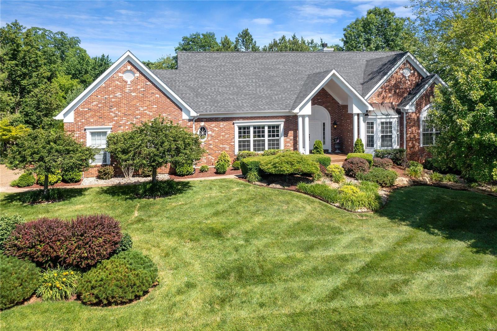 One of a kind atrium ranch with walk-out finished lower level. Meticulously maintained 3 bedroom,3.5 bath, 3 car - side entry garage. The master hosts 2 large closets and a master bath with sep tub and shower, and his and her sinks. The recently remodeled kitchen has plenty of custom cabinetry, smooth electric cooktop, wall oven and microwave, 2 large islands w/granite countertops - one for prep and the other with copper farm sink is large enough for dining. Large deck over looks a paradise. Vaults, trey ceilings, crown moldings, beautiful hardwood flooring, are just a mention of the rooms of fine details. Those wall of atrium windows will lead you down to the fantastic finished lower level. Enjoy a family room, kitchen, media room, 1 addl bedroom, full bath all exude luxury. But wait, you are about to enter a fairy tale-like backyard. Private inground pool, gas fireplace, bocce ball court, trails, patios, lush mature landscapes. Luxury just minutes from Chesterfield's Boone Bridge. Additional Rooms: Sun Room