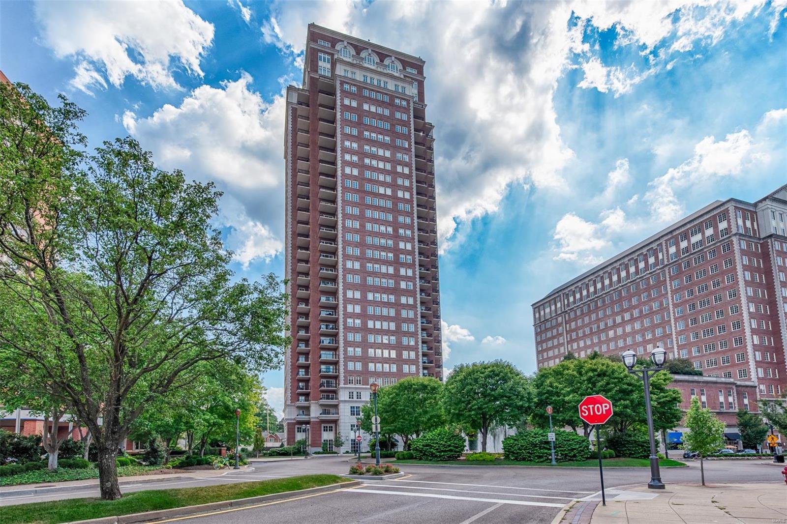 Located on a corner of the desirable Plaza condominium building in Clayton, this unique condo offers the ultimate in privacy and tranquility. This spacious three bedroom, two and a half baths, open floor plan includes almost 1100 square feet of outdoor terrace with direct access to the Plaza’s luxurious outdoor landscaped pool. Sliding glass doors facilitate the flow of the indoor and outdoor space blending it together as one large living and entertaining space. The Master suite has its own wing and includes two walk in closets, a large master bath and a separate office. Two additional bedrooms, one with a walk out to a terrace, share a second large bath, its own entrance and a full laundry room. This gracious building is complete with a large formal lobby, valet and concierge, a designer decorated club room, outdoor pool deck, fitness room and large dog walk area. Two premier parking spaces and a storage space are included with this residence. Location: End Unit, Upper Level