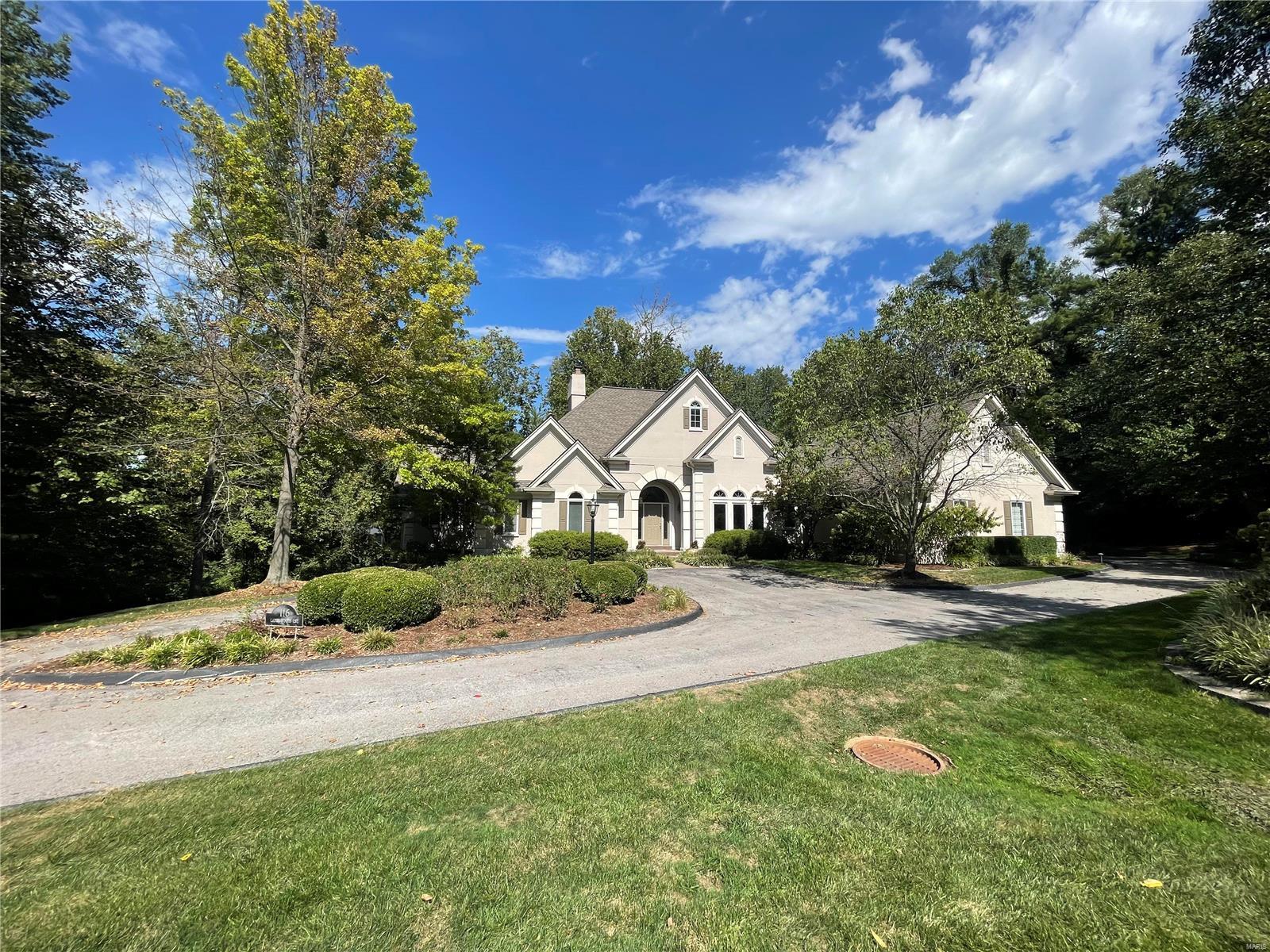 What an exceptional home.  This stunning custom atrium ranch is loaded with every whistle and bell.  Beautifully updated over the years and in excellent condition.  Large great room in the center of the home.  Formal dining room with marble floor.  Updated custom kitchen with white cabinets and stunning granite counter tops.   Huge master with 2 walk in closet and master bedroom.
The lower level is like another house.  Large family room, rec room, office, wet bar, wine room, 2 bedrooms and hall bath. Three car garage, screened porch, very private lote with mature trees on three sides.