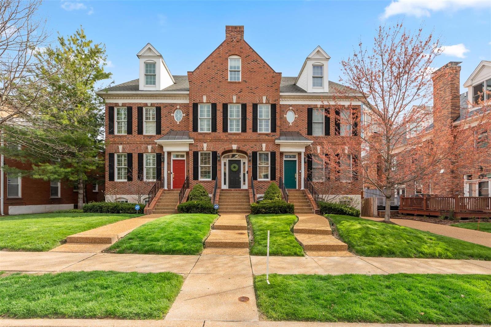 Premier location in the heart of Clayton for this stately,3-story brick townhome. Location is everything overlooking Shaw Park and within walking distance to work,dine,shop,swim or go to school. Brand new maple floors,10ft ceilings, custom millwork and high end finishes are found throughout the home. An open and versatile floor plan allow you to live and entertain as you desire.The kitchen is an entertainer's dream with granite countertops,professional stainless appliances, center island and custom cabinetry.Enjoy the gas fireplace in the dining/hearth room that opens to a private deck. The master suite is extravagant in size and finish with a jacuzzi tub, marble counters and a generous walk in closet. The second and third bedrooms also contain their own full baths and walk in closets. Enjoy additional living space in the vaulted great room on the 3rd floor, adjacent to the 3rd bedroom. The 3 car garage is tucked under the deck and leads to a full basement for storage. This is the one! COOL: 14 SEER+