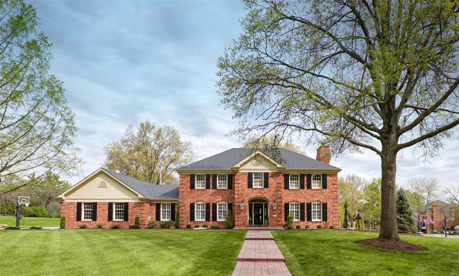 This meticulous, completely upgraded, two-story brick colonial is ready for you! The enormous, renovated gourmet kitchen includes updated cabinets, an abundance of storage, granite countertops, subway tile, under-cabinet lighting, a large island, stainless steel appliances, and an eat-in area with a built-in bar and Scotsman ice maker, perfect for entertaining! The all-season, climate-controlled sunroom gives you a spectacular view of the amazing backyard, custom pool, and professionally landscaped backyard, with 2-tiered water feature, that feels like an oasis. This gorgeous home features a dramatic floor to ceiling full masonry limestone fireplace and hearth, master suite with coffered ceilings, huge walk-in closet, remodeled master bath with travertine floor/shower, newly finished basement, oversized 3-car garage, custom millwork, bay windows, skylights, lawn sprinkler, security system and sits on a level lot with new steel rod fencing and mature trees. 1 year home & pool warranty! Additional Rooms: Sun Room