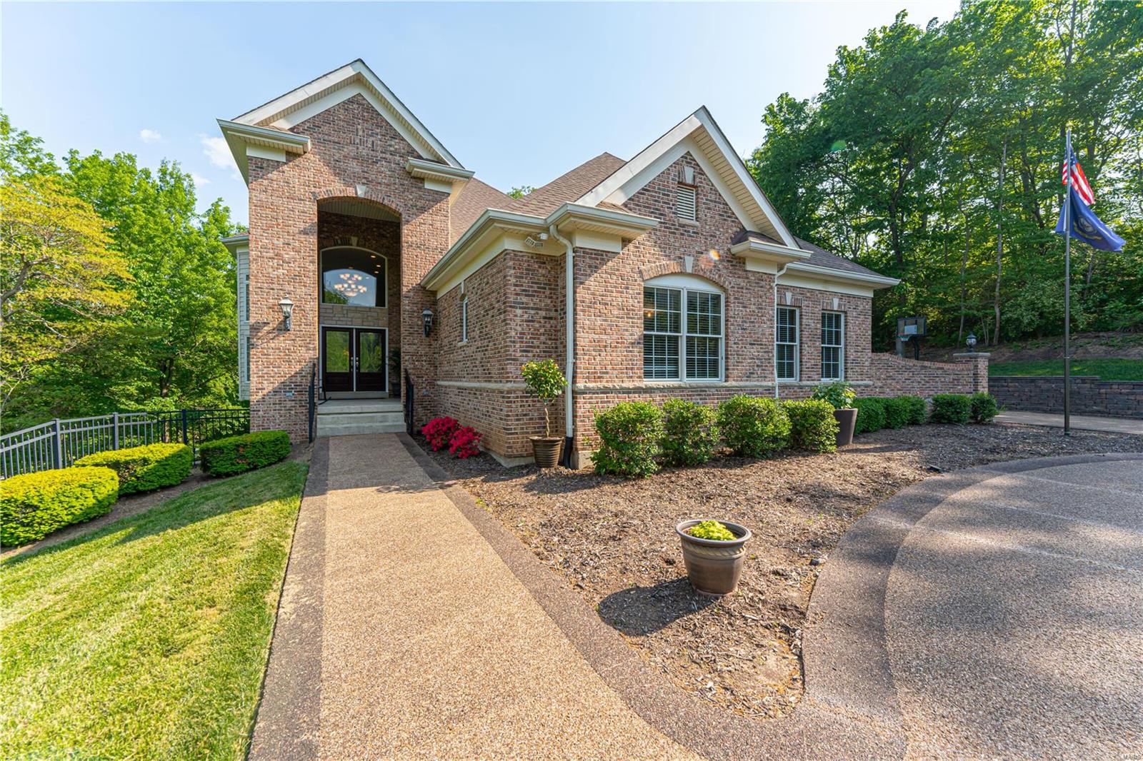 Spectacular 1.5 sty on 1 ac. backing to woods and overlooking Sunset Hills Golf Course. As you enter the stately foyer you will know this is the one for you! Over 7000 sqft of total living area w/4 Bds, 5.5 Bths.  An entertainer's dream w/gourmet Kitchen, custom cabinets, breakfast bar, butler pantry & Breakfast Rm leading to veranda. Custom window treatments to designer closet space are among some the features.  You will relax in the Main floor King size MSTR Bedroom Suite and MSTR bath with jacuzzi tub. The UL open Loft w/3 BDs, 1 en-suite, 2 share Jack/Jill Bth. Plenty of space in added Bonus Room with hidden wall features for extra storage.  But it doesn't stop there.. The LL offers plenty of finished area to gather, work out or play.  The wine/safe room is a must see! Everyone's dream to have organized storage is included as well in the 1400 sqft unfinished area. 
The backyard is private & perfect for all of your outdoor get togethers. Your whole family will love this home! Additional Rooms: Wine Cellar