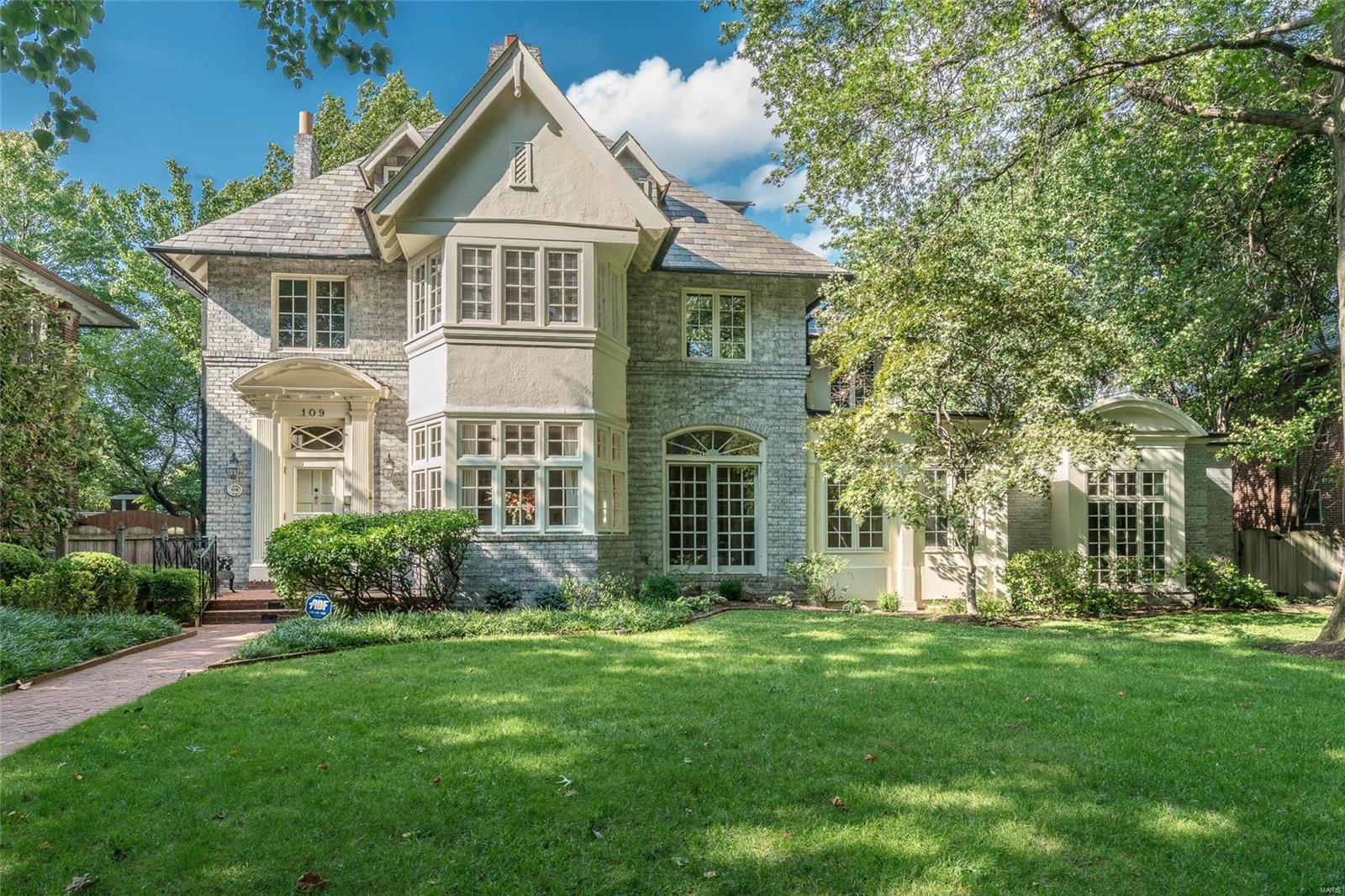 Clayton’s Hillcrest neighborhood is an especially sought-after location, and rarely does the opportunity to acquire one of its most notable and beloved homes that rests on a double lot present itself! The expansive, light-filled formal living room features transom windows, a fireplace and built-in shelving. The family chef will enjoy the well appointed eat-in kitchen.  The dining room will accommodate the largest dinner parties.  The sizeable family room with fireplace, sitting area & wet-bar to service the pool make entertaining a breeze in this flexible, unique floor plan. You will find your private retreat in the Master Suite with luxurious bath that showcases the soaking tub, separate shower and double vanity. Tucked away off the master suite is a secluded office.  3rd floor with 2 additional bedrooms and bath. 2 car garage. Blue-Ribbon Award winning Captain Elementary, Wydown Middle, In walking distance to Clayton restaurants, shops, Forest Park and Wash U.