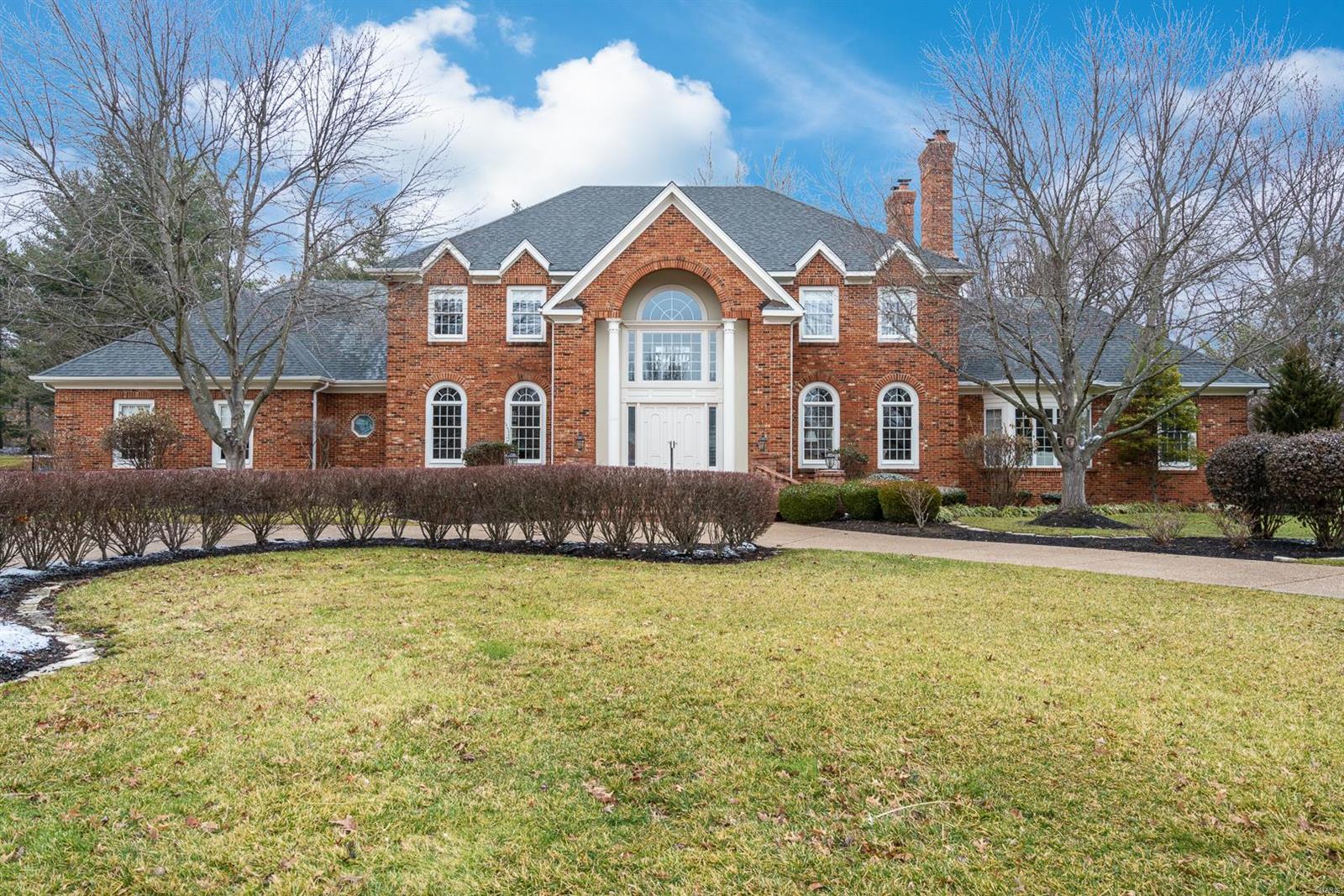 Recently refreshed stunning Colonial two story all brick residence with 10 ft ceilings (1st), dramatic 2 story marble entry and hand carved Italian marble fireplaces in LR/FR/MB. Exquisite mill work in LR/FR/DR/Foyer and hardwood floors in LR/DR/FR/Kitchen. A generous family room offers a bay window and walk behind wet bar. The large kitchen includes a breakfast room, a center island and a planning desk. The first floor master suite w/coffered ceiling boasts a bay window, a large walk in closet and large bath with separate whirlpool tub & shower. The convenient main floor laundry off the kitchen completes the first floor. The second floor office has built in bookcases and double doors. The 4 upstairs bedrooms have spacious walk in closets and include 2 Jack and Jill bathrooms. The in ground pool/spa along with the adjacent pool house and generous patio offers opportunity for family fun and entertaining. Extensive landscaping and in ground sprinkler system for easy maintenance!