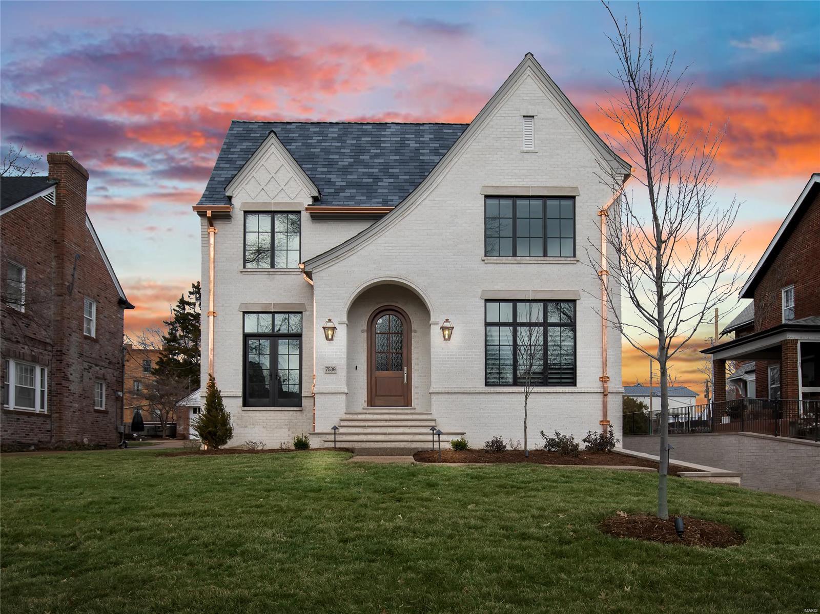 Built in 2022, this 4 bed/5 bath Clayton home has it ALL- elevator, pool, and a gate for direct access to Hanley Park.
Stunning all brick home w/ slate roof, Pella windows & doors, and copper gutters. Stunning moldings, trim, & white oak flooring throughout. Large open foyer opens to den/office with a Juliet balcony. Formal dining room features a box beam ceiling & leads to the butlers pantry w/ custom inset cabinetry throughout and walk in pantry. The well-appointed eat-in kitchen includes a wolf range, 2 30" subzero units. FR includes fireplace and built ins. 2nd level includes the primary suite- complete with spa-like bath and oversized WIC w/ center island. 3 add/l bedrooms (1 en suite and 2 with JNJ bathroom) and full laundry. LL includes mudroom, half bath and 700 ft of living space. Fabulous covered patio leads to the heated Pebbletec pool. Aggregate driveway. Professionally landscaped yard w full irrigation.