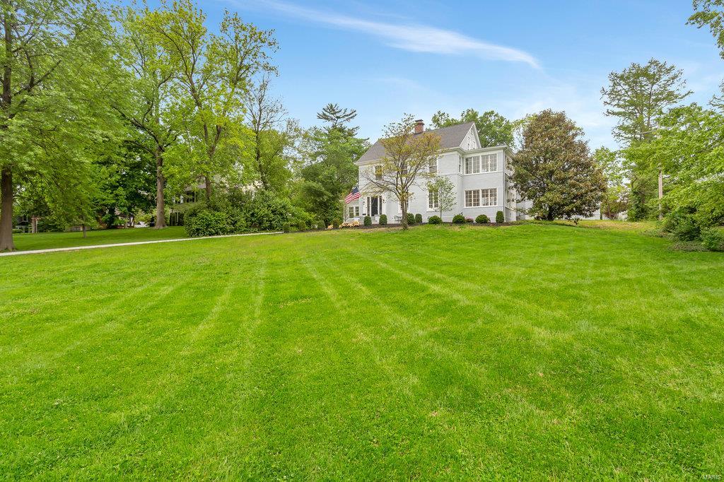 This home sits on one of the best lots on one of the most highly sought after streets in Webster Groves! The large living room has a gas fireplace with marble surround, hardwood floors and built-in bookcases.  Off of the the living room is a beautiful formal dining room with 3 walls of windows.  The huge chef's kitchen features quartz counter tops, stainless appliances and white custom cabinetry.  The kitchen opens to a large family room and breakfast room and has breathtaking views of the new pool and built-in hot tub!   The main floor also features a den with built-in wine cabinet that is perfect for a bar or home office.  The main floor master suite features a huge bathroom with stand alone tub, huge walk-in shower and double vanities.  The master also features two closets, one with it's own washer and dryer.  The second floor features 3 more bedrooms, 2 full baths, laundry room and office.  The third floor has a 5th bedroom, full bath and loft area. Additional Rooms: Wine Cellar