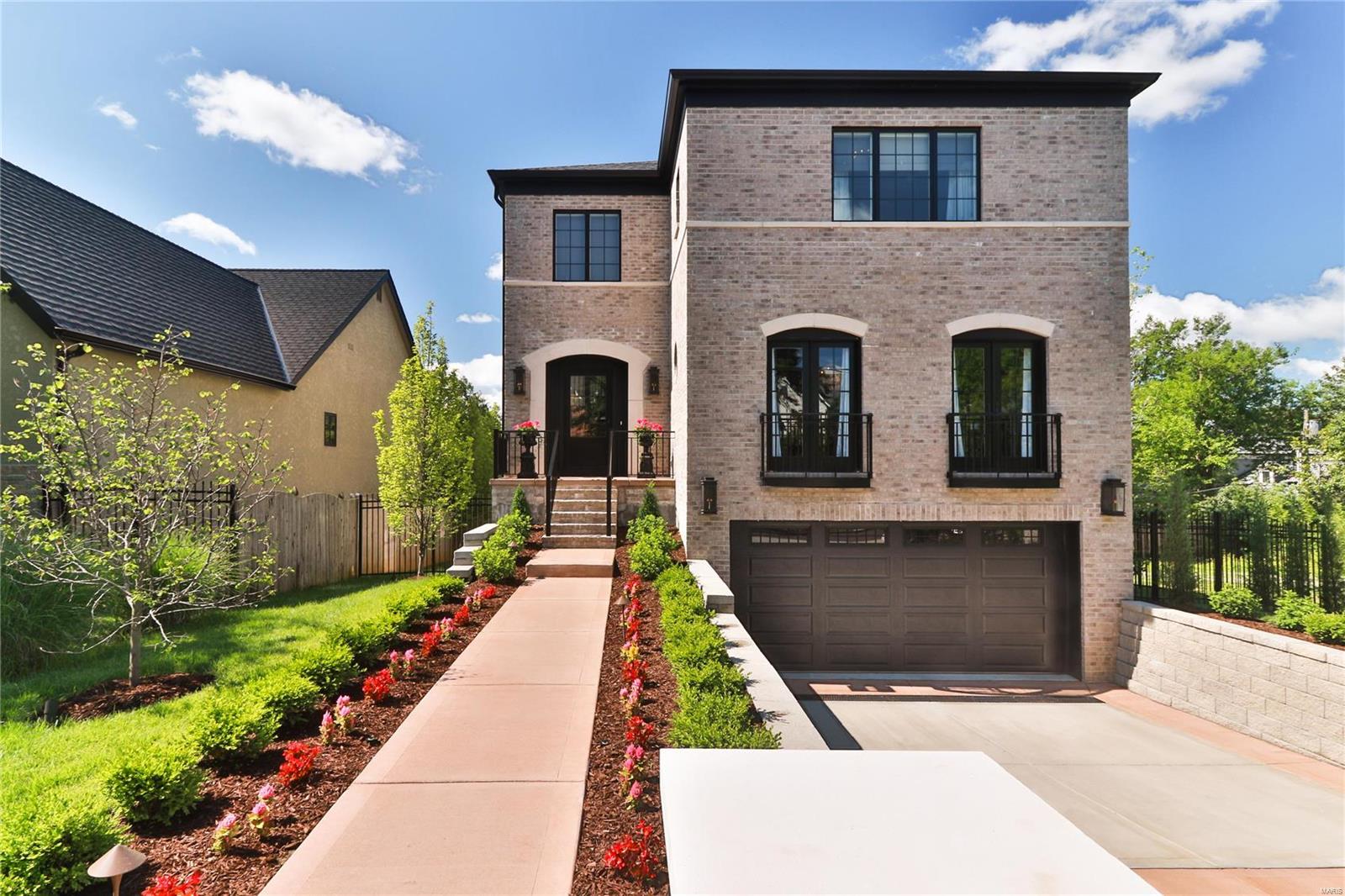 Luxury Living just steps from Clayton! 2 years NEW this is the Best of transitional decor-almost 5000 sq ft of living space. The finest in details & construction w/open flr plan. 4 bedms / 4 full baths plus powder rm. ELEVATOR to all 3 floors. Main floor boasts impressive entry, office area & large DR. The kitchen features a breakfast bar, breakfast rm, a beautiful center island, a large farm sink, custom cabinetry & high-end appliances. Walk-out to LRG maintenance free deck off the breakfast rm w/ a pergola. Beautiful proportioned Great Rm w/ bar area & lovely frpl. 2nd flr serene Master suite w/ amazing bath w/ a Spacious walk-in closet to fit ALL your needs. The walk-out LL w/Additional Fam Rm, bedrm, full bath. Fenced lot-space for pool. Heated garage offers 2 oversized spots. PLUS 2 sep. parking pads. Security system, irrigation, prof landscap, closet systems,wiring for AV/TV's, screen door on deck, gutter covers, TVs & hanging brackets (5), AV equipment-all in one remote. Some Accessible Features