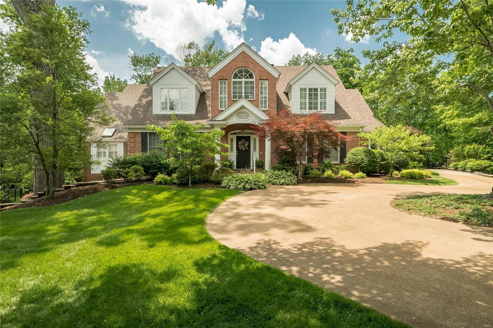 Nestled at the end of a cul- de-sac on a private Ladue lane, this outstanding 5 bedroom, 5.5 bath, 1.5 story is filled with all the amenities for today's lifestyle. The 2 story foyer immediately takes you to the fabulous great room with fireplace, wall of windows and bookcases and views of the pool and lush grounds. Generous size dining room opens to the bright white kitchen/hearth room with doors to the awesome pergola with retractable roof. Wonderful main floor master suite with his/her closets, newer marble bath with his/her vanities and charming sitting room. Upstairs are 3 bedrooms one en suite and two with jack & jill all with great closets.  The open staircase from the kitchen leads to full walk out with huge family room with built ins that access the outside pool area, full kitchen, billiard room, exercise room, 5th bedroom, office with built in desk (could be 6th bedroom) 2 updated full baths and terrific storage. Main floor laundry, 3 car oversized garage, large fenced yard.