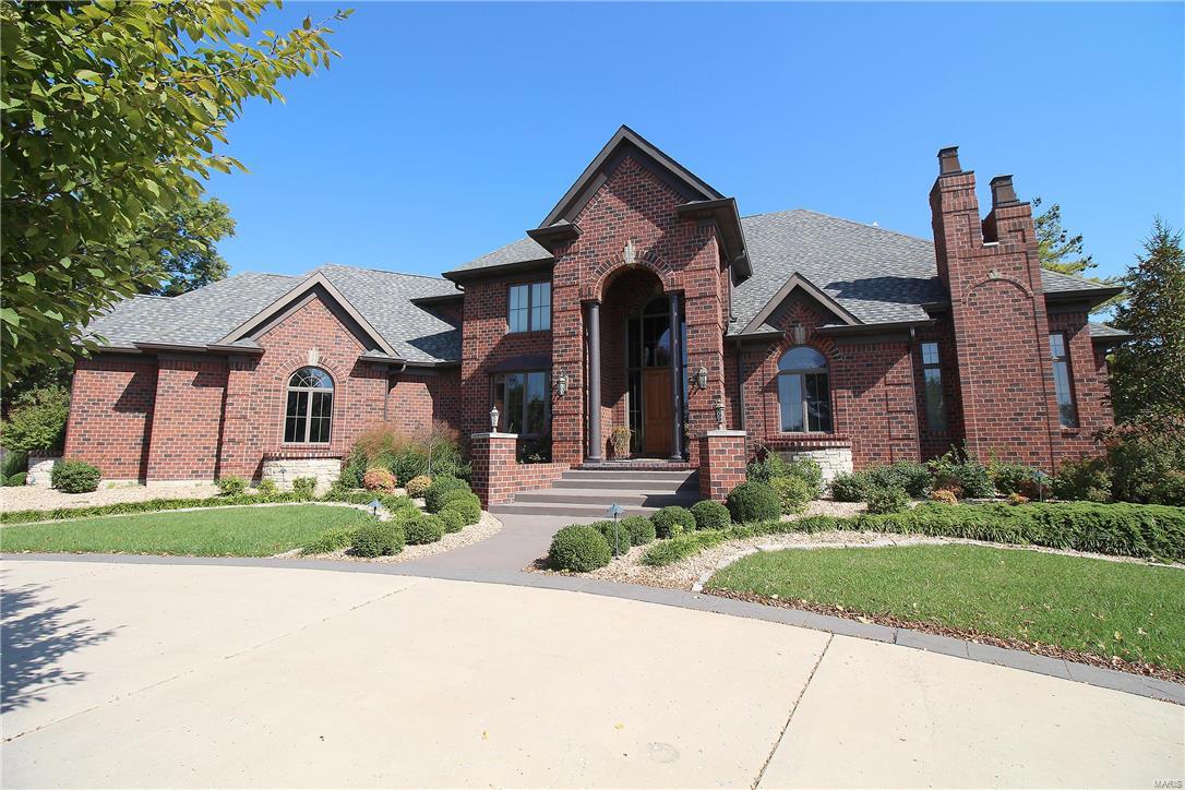 Chance of a lifetime! Move-In-Ready Luxury! Custom built 4 bdrm, 5 full, 2 half bath home is waiting for you! Spectacular 1.5 story all brick, has it all: Custom gourmet kitchen, Viking 4 burner, 2 griddle gas stove with pot filler, 2 ovens, NEW: microwave, dishwasher, fridge, ice machine, 2 wine chillers. 54" custom cabinets offer tons of storage, huge island, granite counter tops. Imagine entertaining in this gorgeous home.  Breakfast rm, hearth rm, living rm, formal dining, office w/ built-ins.  The flow of this home is open and wonderful, an entertainer's dream. Main floor master suite with a sitting area, luxurious master bath, HUGE walk-in closet with closet system, motion sensor light. Three large upstairs bedrooms have private baths and walk-in closets.  2 Laundry rooms (ML & upstairs).  A well thought out floor plan lends to space for all. Upstairs bonus room really is a bonus. Finished basement, workout room, bar and walk-in safe. Gazebo, 4 car garage + more.