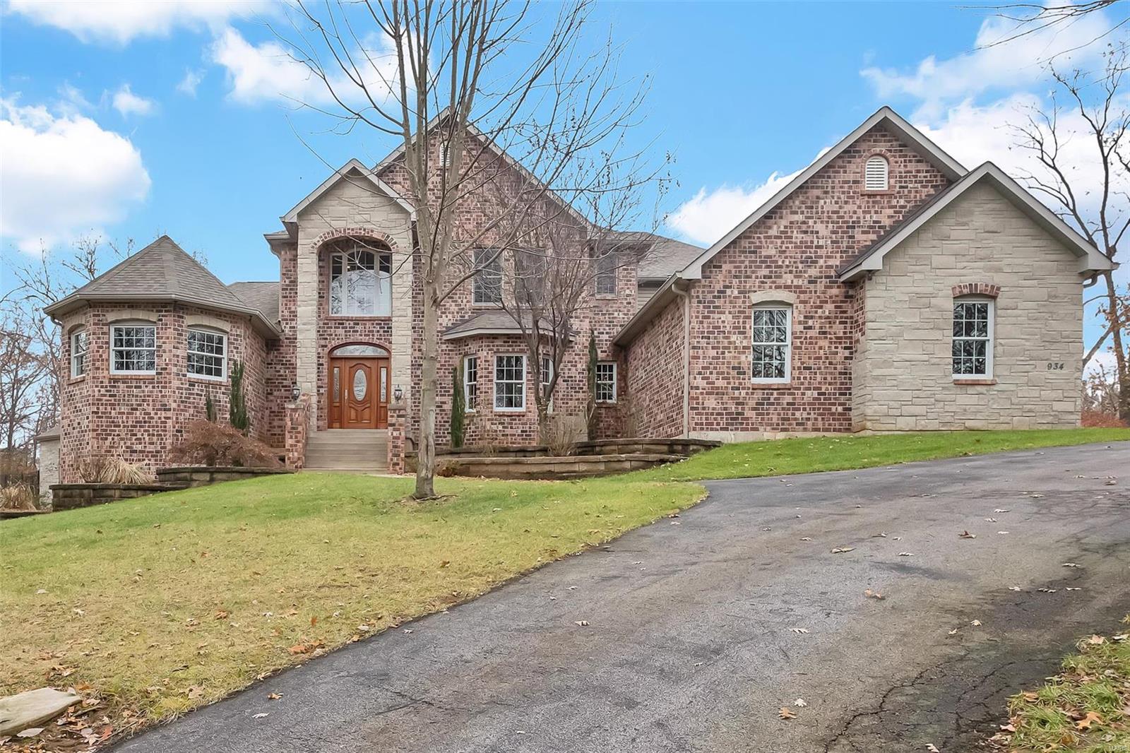 Welcome to the private, gated community of Norrington. Custom built, original owner home w/ almost 7,000 fin. sq/ft & a 4 car garage! Private, tree lined back yard w/ a large gunite in-ground pool & pool house. Stunning curb appeal w/ brick & stone along w/ a circle drive. Upon entry you'll find a 2 story entry w/ a grand staircase, there is also a rear staircase off the kitchen. The great room has a beautiful wall of windows over looking your private back yard perfect for entertaining. Huge kitchen w/ a wrap around granite breakfast bar, upgraded appliances, walk in pantry & opens to the breakfast room w/ a beautiful fireplace. Off the breakfast room, double doors lead to a hearth room w/ main floor office that could easily be converted to a 2nd main floor master. Upstairs a loft, 4 large bedrooms w/ walk in closets & Jack & Jill baths.  The LL was professionally finished and offers 2 walk-outs, a beautiful bar, huge open family/rec room, exercise room and so much more! A MUST SEE..