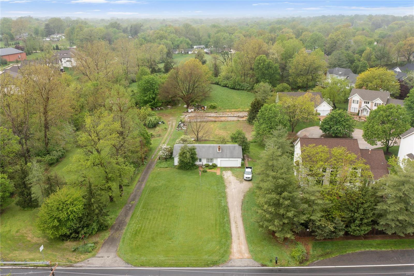 Here’s your opportunity to own a beautiful hidden gem located off of the desirable Mason Rd in Creve Coeur on 8.45 acres! Multiple Sections of the property are mostly cleared and leveled and awaiting your plans for endless opportunities. This property has public water, sewer, and electric. This lot is so secluded and private you’ll forget you’re minutes from shopping, dining, and major highways. This land is suitable for a family compound, large estate, or a custom-built small neighborhood. Seller is providing engineer reports that include three variable plot plans and a topography report.