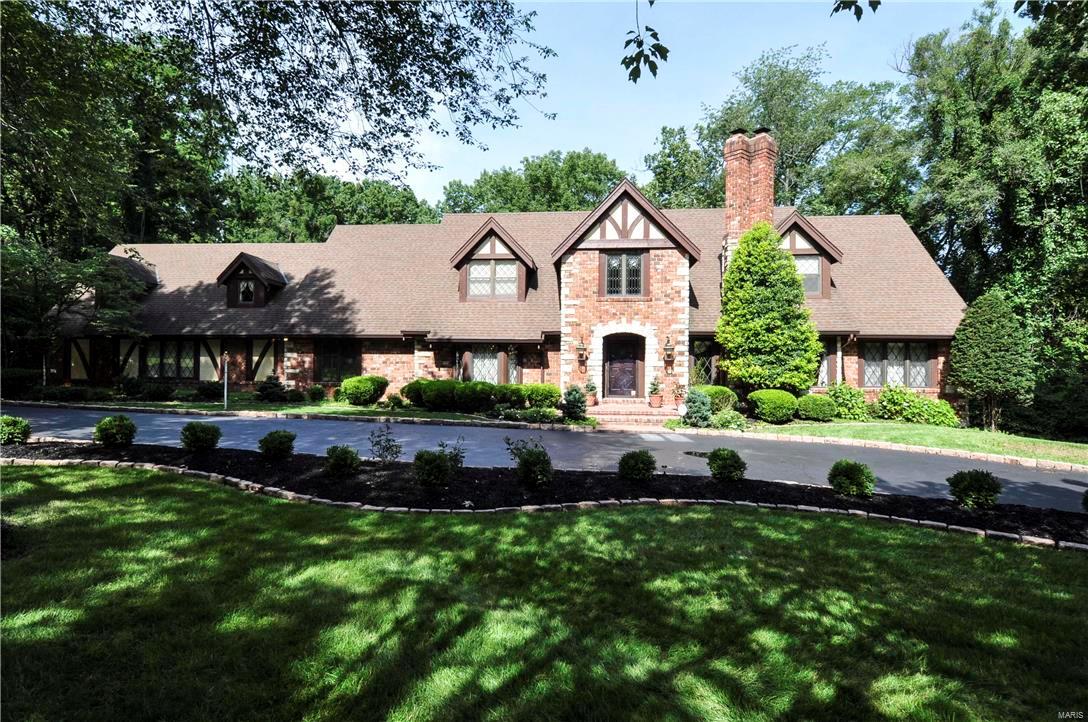 Est. 1979, Stately Elegance encompasses this One-of-a-Kind designed home by famed architect, Irwin J. Buxell Jr. Located in prestigious Ladue Lake Estates Neighborhood. 6bed/6bath 4629 sqft home situated on 1.55 acres of lush surroundings, is unsurpassed in its craftsmanship & luxury. Must see the superior finishes~Stained Glass Windows, Herringbone Floors, Antique Brass Chandeliers, Custom doorknobs, 5" crown molding, 9" baseboards, 2 Masonry Fireplaces, Kirkwood Stairs custom woodwork throughout, list is unmatched & endless! Main floor Master Suite, Great Rm w/paneled ceilings & built-in bookcases, Living Rm, Dining Rm, Chef's Kitchen, Breakfast Rm, Sun Rm, Laundry, Office/Extra Bed, 2 powder rms. 2nd Floor offer 4 beds/3 baths. Zone HVAC, 2~75gal Hot Water Htr, 9 ft pour walkout basement. Back yard perfect for a pool! Car enthusiast will appreciate the oversized 3 car attached garage+2500 sqft Carriage House large enough for a Boat, RV, or 12 Cars! Please click movie icon for video. Additional Rooms: Sun Room