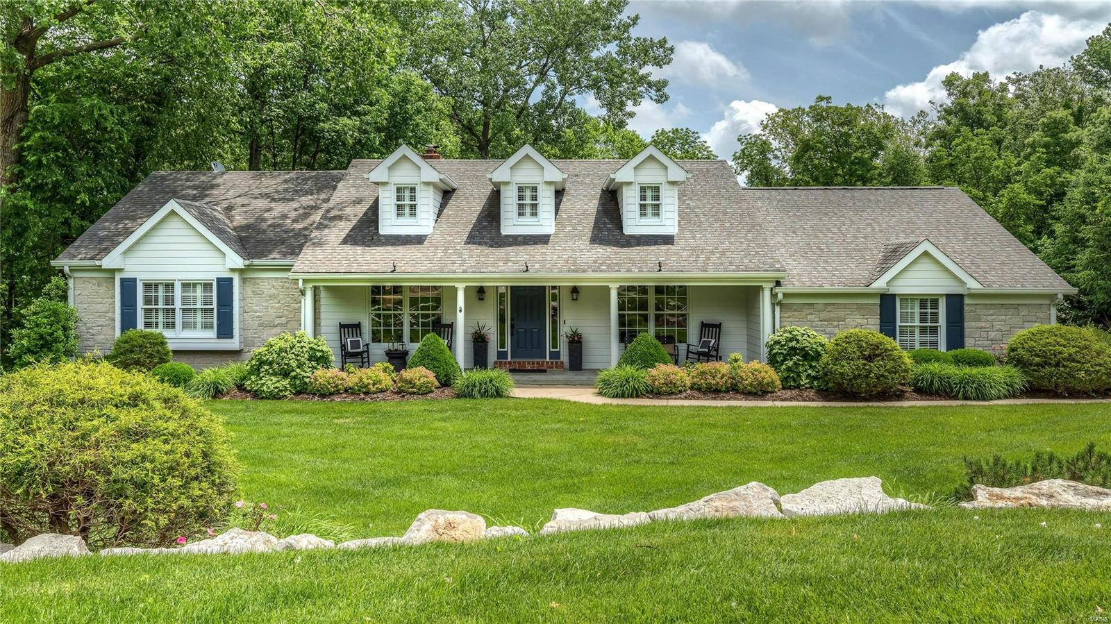 Picture perfect Colonial on 1.3-acre grounds! Dramatic 2-sty foyer features gleaming oak flooring that flows into the formal living & dining rooms & spacious family room with handcrafted bar, floor-to-ceiling stone fireplace flanked by built-in bookcases & atrium doors that open to screened porch. Exceptionally large kitchen with 42” glazed buff cabinetry, granite countertops, KitchenAid appliances & center island adjoins breakfast room with tray ceiling & wall of windows that overlook parklike backyard . Master bedroom suite with wide bay window, customized walk-in closet & Carrara marble bath with shower spa & 2nd generous-sized bedroom with custom built-ins complete the main floor living quarters. Hardwood staircase accesses 3 additional bedrooms & hall full bath. Lower Level entertainment space includes recreation room, game room & media room plus workout room, guest suite & pool bath. Situated on a private cul-de-sac lot with deck, 2 patios & pool surrounded by landscaped gardens.