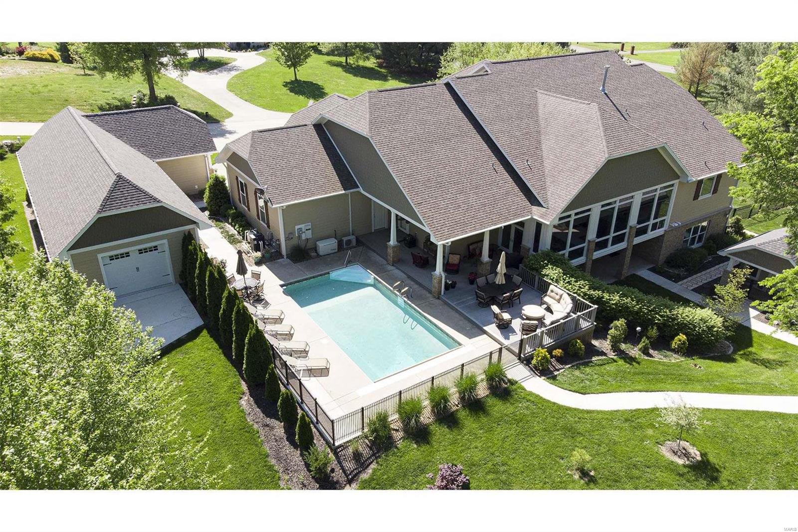 HELLO GORGEOUS! Every aspect of this home is impeccable.Fabulous finishes and designer palettes throughout.Since 2018 the landscape and grounds have been transformed with the addition of a 30X60 luxury shop/garage with heat & a/c (with the already attached 4-car,this gives a total capacity to garage 8 vehicles) + a 5-STAR 20X20 Kennel with bathing/grooming station & Steel Fencing now encompasses a large area of yard + sidewalks, terraced walls and new, composite decking now overlook the sparkling 7' deep, heated 16X32 saltwater pool, also added gas exterior lighting.The sunporch was enclosed to create a spacious living room with lovely views. A foyer is flanked by a formal dining room with unique tray ceiling. Open-concept, Country French Kitchen/Hearth room has a new frig and double-oven.The kitchen boasts a bank of 4 dishwasher drawers! Master bath has heated tile floors with a separate timer/control for the walk-in shower floor,His & Hers Walk-in closets.A 9X21 All-Concrete Shelter. Additional Rooms: Mud Room