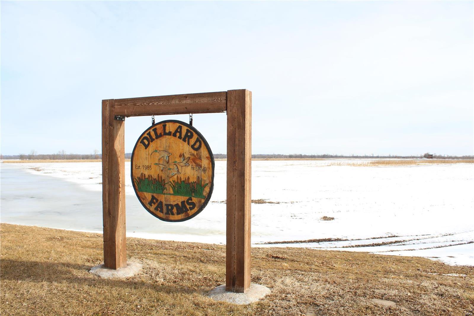 The Dillard Club is one of St. Charles Counties premier waterfowl hunting properties! Property is 220+/- acres just north of St. Peters & I-70. Newly constructed club house was designed to not only give hunters a nice place to relax before or after the hunt & is very functional.  Entering the rear is a large changing/storage area w/concrete walls that can be easily cleaned when flood waters get to the house. Area is perfect for decoy, ATV/UTV, waders, ammo & clothing storage. Living quarters are elevated approx 4' above 1993 flood levels & though possibility exists that water could get to the finished portion it is at a minimum improbable. 2 BR, big living area & kitchen, ceramic floors, FP. 4 concrete & 1 one steel pit strategically placed on the farm hold 3 to 8 hunters. 2 wells; 1 installed in 2019 & are strategically placed so water can be kept open around 3 pits, even in coldest of temp. Levee system has been well maintained & provides nice access to the pits on the property.