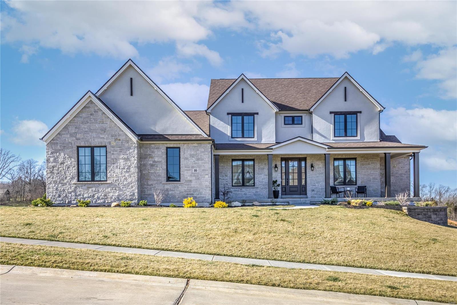 Welcome to this LUXURY custom 1.5 story home on just under .5 acre in Westleigh Subdivision! Why wait to build when you can have this 1 year new home with 5 beds/4.5 baths & oversized 3 car garage? No detail was forgotten w/ gorgeous luxury vinyl plank floors, 8 ft doors, stunning barn door & high end lighting. The kitchen exudes style with tile backsplash, high-end appliances including WOLF built-in coffee maker & built-in refrigerator, water pot filler & quartz counters. The butler's pantry is great for entertaining. The well appointed mudroom & laundry room keep life organized. Slip away to the master w/ trey ceiling, HUGE walk-in closet w/ professional organizer. The master bath is a work of art w/ tile floor, marble shower & jetted tub. The finished basement is perfect with a rec room, bed, bath, office & walks out to a level yard with sprinkler system-perfect for a pool. This Spring enjoy a cup of coffee on your covered deck while sitting by the fireplace. Schedule your showing! Additional Rooms: Mud Room, Sun Room