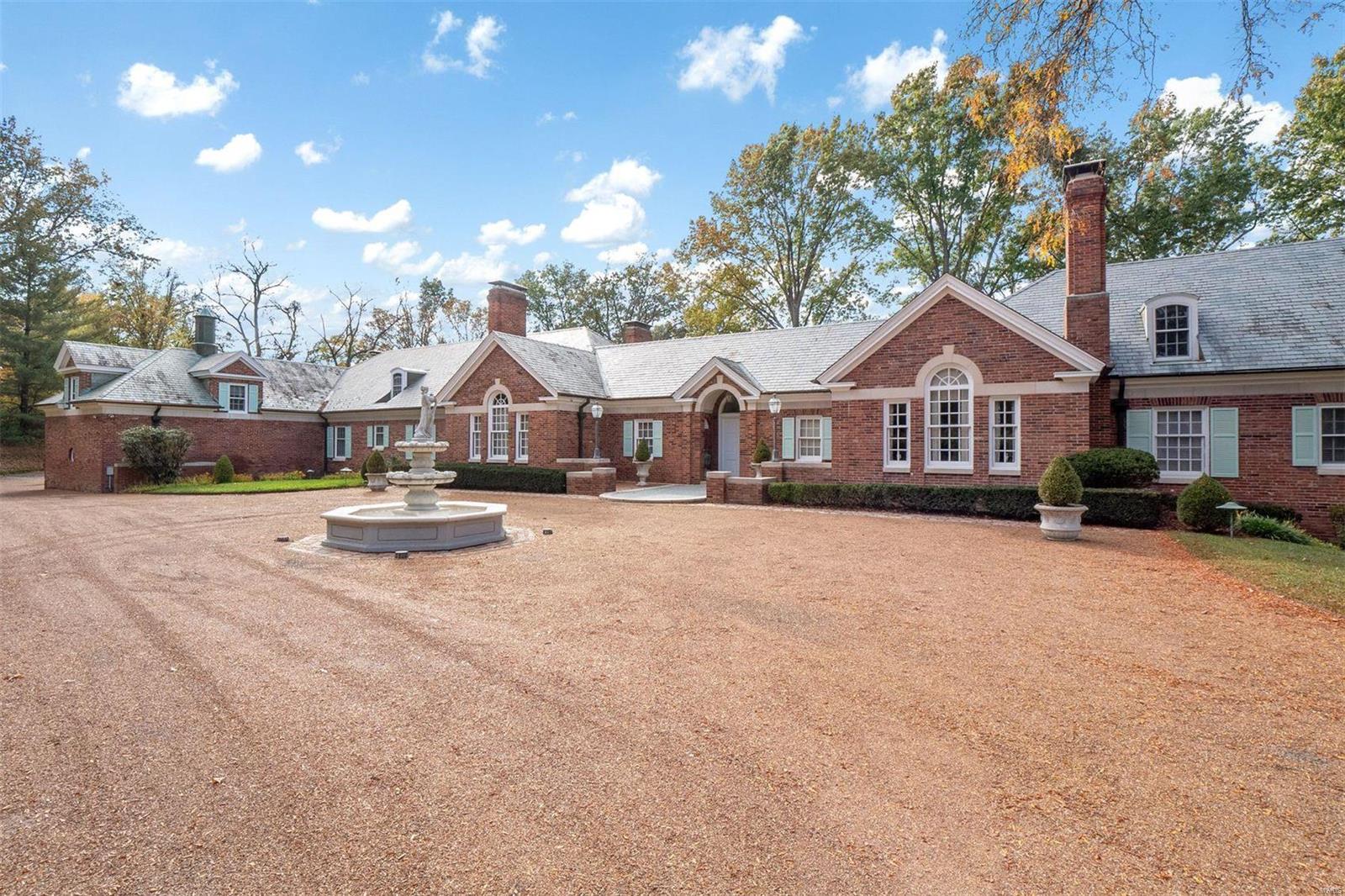 Spanning 4.66 acres & nestled in a distinguished Ladue neighborhood, this expansive French country estate created by renowned architect Raymond Maritz stands as a testament to refined taste. Immaculate molding & exquisite finishes are evident in every room, each detail carefully curated to create an atmosphere of timeless sophistication. With its barrel vaulted ceiling creating an air of majesty, the DR is a perfect setting for hosting lavish dinner parties. Resplendent with rich wood paneling, the Library offers a quiet retreat. The spacious Kitchen boasts high-end appliances as well as a large butler’s pantry. The estate also includes a separate guest apartment boasting 3 bedrooms, 1 ½ baths, cozy LR/eating area, plus a fully equipped kitchen helping to ensure the privacy & comfort of your guests. Outdoor living is equally impressive, w/a lovely pool offering a perfect setting for relaxation & entertainment. The historic barn adds a touch of rustic charm to this luxurious property.