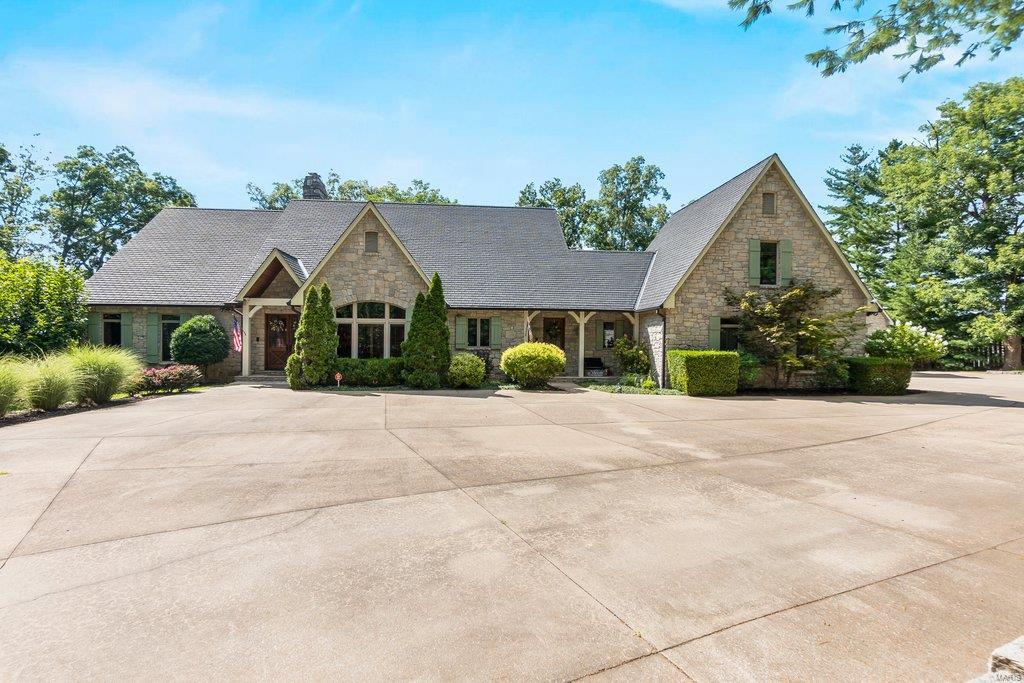 Located in one of Cape’s most sought-after neighborhoods, this stunning home sits on just over 4 acres. The custom built home features a spacious master suite with his & her closets, a den featuring built-ins, coffered ceilings and fireplace, the kitchen features a large island, high end appliances and is perfect for entertaining. The open floor plan welcomes you to an inviting great room with vaulted ceilings and stone fireplace. Perfect for morning coffee and viewing wildlife, the two story screened in porch allows for nearly year round use with ceiling fans and infra-red heaters. The basement includes a new full kitchen steps away from the large living area and three bedrooms and two baths. Step outside to the beautifully landscaped yard with bonus detached heated and cooled three-story garage which can hold multiple cars. This one of a kind home is beautiful, private, and ready for you to move in.