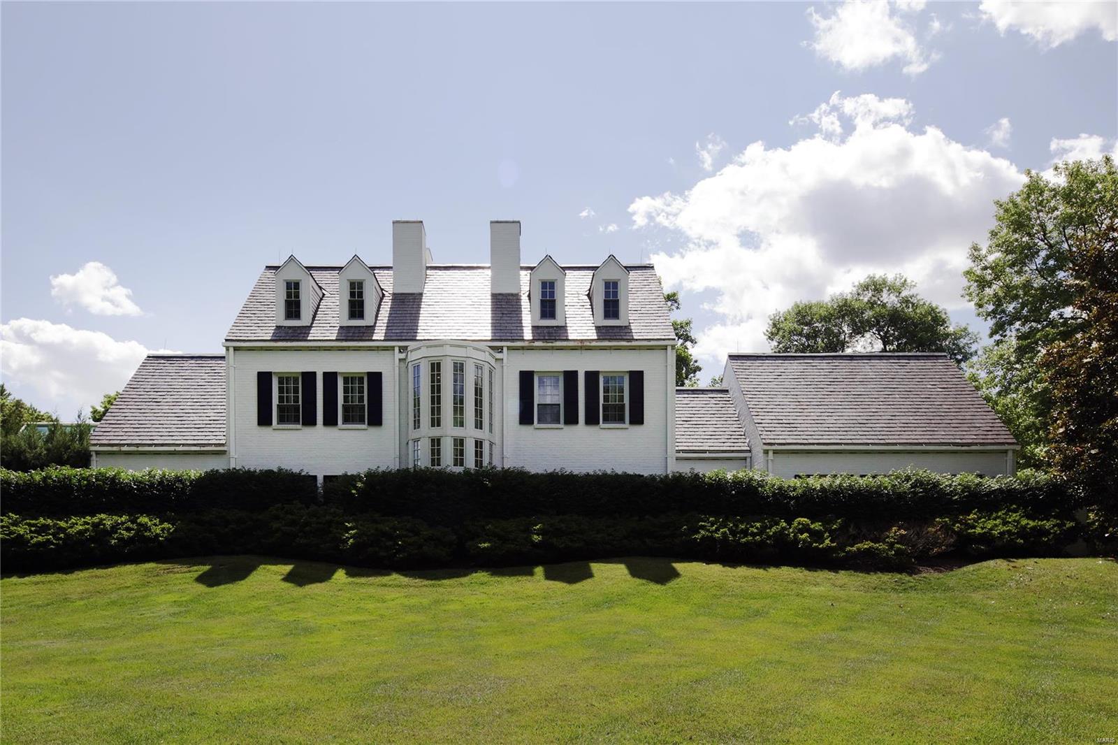 Exceptional contemporary home that blends perfectly into the sought after Dromara neighborhood! Ready for the next owner to add their personal touches, this property offers spectacular privacy on 1.61 acres. Or one could elect to build a new home on this property.

Main level master wing with breezeway, sitting room with fireplace, juice bar, and His and Her walk-in closets. Master bedroom walks out to spa and over looks pool. 4 bedrooms and 3 baths on upper floor and finished basement offer approximately 8,000 sq feet of living space. The pool is an absolute must see and provides a private oasis minutes from Clayton in the heart of Ladue. Built-ins, wet bar, mud-room, main level laundry, security system, 7 zone HVAC, green house, auto court, and ample storage, this house is one of a kind!

Please note the property's southern property line extends onto the rear driveway and rear yard of 7 Dromara.