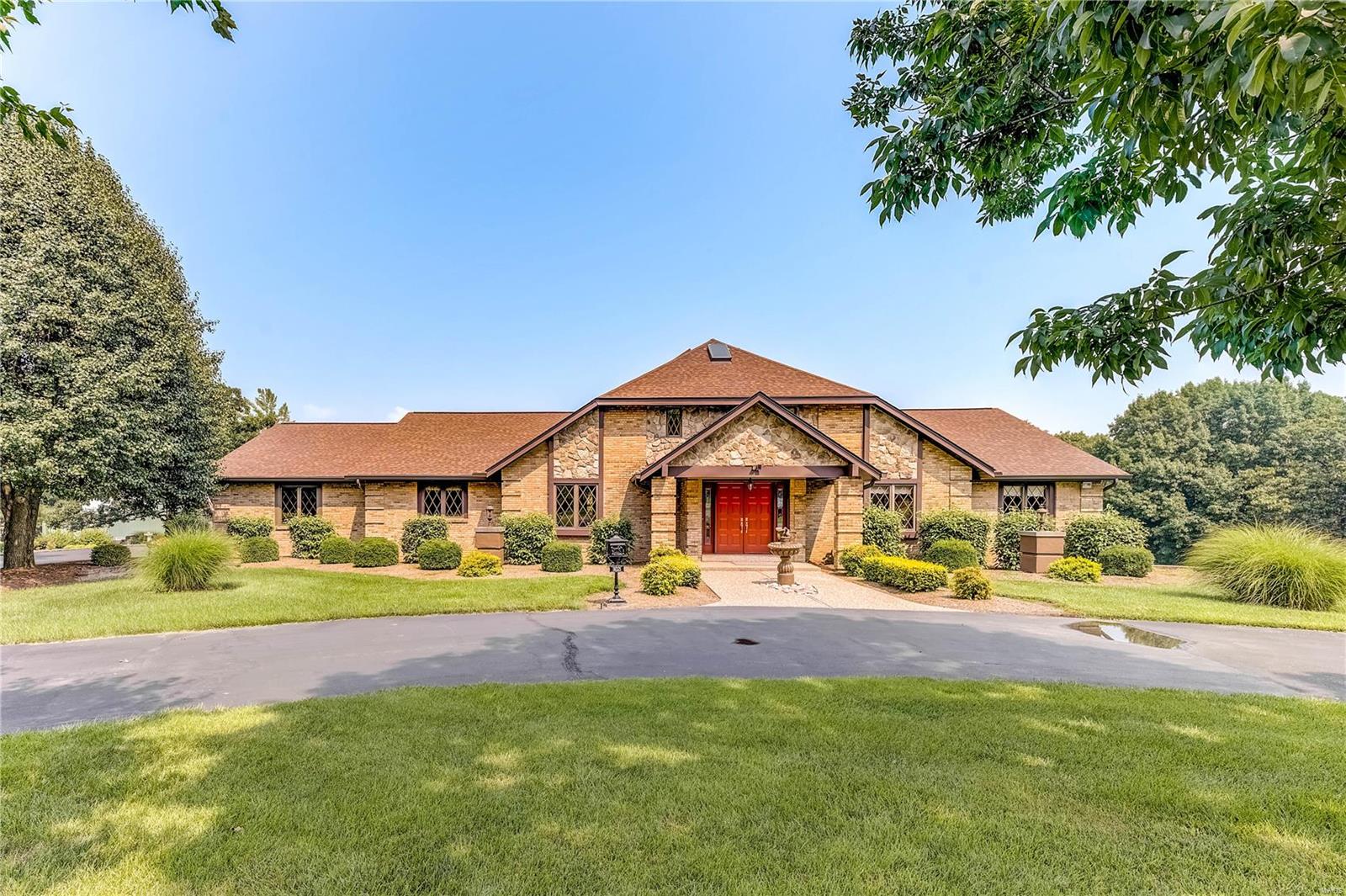 Welcome to this unique property: Builders custom home on 16.04 acres of beauty, superb landscaping, and privacy. Enter the exquisite foyer to this lovely home. Main floor: 3 bedrooms each with a full bath plus ½ bath, sunken living room, gourmet kitchen, large breakfast room, dining room and laundry/office. Enjoy the view from the four-season room. Lower-level living/ entertaining quarters: large bedroom, walk-in closet, full bath. Complete kitchen with very large counter, eating and socializing area all leads to screened area, large patio and lighted shuffleboard court.  A tremendous outbuilding 79’x43’ to accommodate various needs: 5 bays, 3 with 12’ and 2 with 8’ overhead doors, 1 bay heated and cooled with kitchen equipment. Additional parking area at outbuilding.. Home has an oversized 36’x22’ three car garage with utility sink. Property offers many options for the new buyer. Additional Rooms: Mud Room, Sun Room