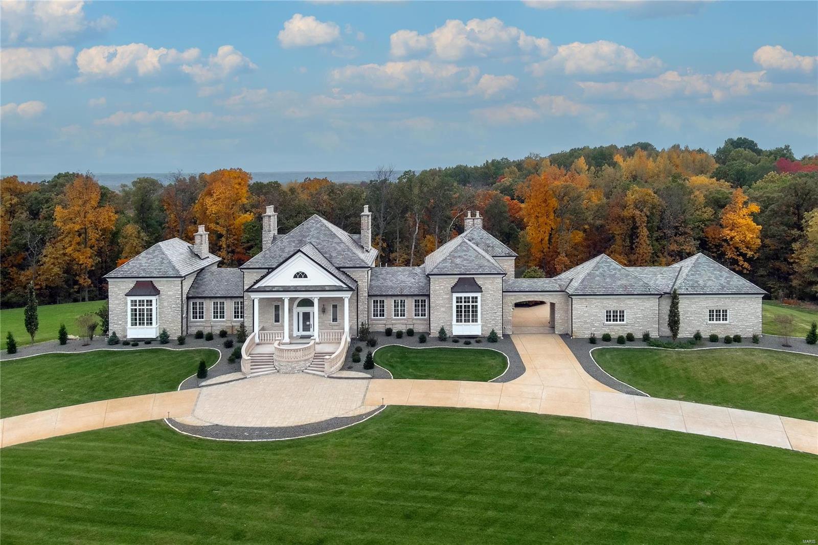 Stunning estate home perfectly sited on a premium 4+ acre setting, located in a gated enclave within Whitmoor Country Club grounds. Quality materials & craftsmanship are showcased inside & out. Limestone exterior, fine architectural detailing, premium slate roof, copper gutters, columns and stone balustrades are all testaments to the fine construction & design. The impressive Foyer opens to the beautifully proportioned Great Room featuring 2 fireplaces, a deeply coffered ceiling, multiple French doors to the rear veranda overlooking a fountain, expansive grounds & woods. The home features 10 masonry fireplaces & too many rooms & amenities to list. Main Kitchen, Catering Kitchen, Octagonal Breakfast Rm & Hearth Rm share an open plan. Luxurious Primary Suite & paneled Study. Newer elevator connects all levels including a step free exterior entrance to access 4 car garage. 3 Bedroom Suites, Rec Rm, Wet Bar, Wine Cellar, Utility/Hobby, complete the LL. Truly an exceptional property! Additional Rooms: Wine Cellar