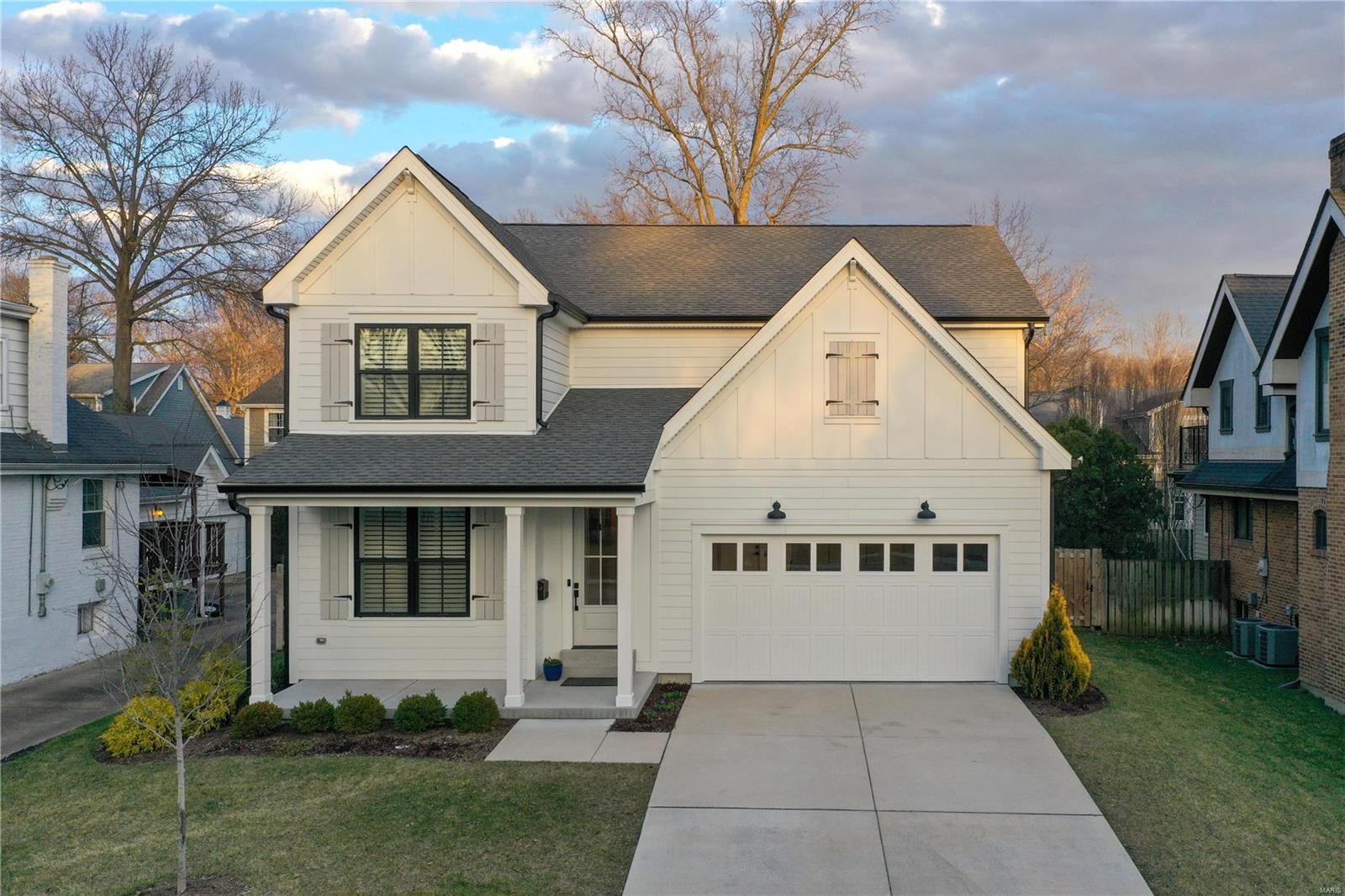 Move-in ready perfection in one of Ladue's favorite neighborhoods, just steps from the best in schools, restaurants & retail! This stunning 3-yr old home offers casual, sophisticated style, with a spacious & flexible layout, 9' ceilings & hardwood floors throughout. The sparkling great room features built-ins, gas fireplace & an open floorplan, with a dining area and sleek gourmet kitchen beyond. A large center island, quartz countertops & stainless appliances make this the hub of the home. A main level bedroom suite can make  an ideal office or separate dining room. Upstairs, the primary suite features a vaulted ceiling & elegant bath with soaking tub, double sinks & shower; laundry, 3 additional bedrooms (one ensuite) and 2 full baths nearby. The 900 sq ft LL boasts 9' ceilings, large rec rm  & bedroom suite with egress. The picturesque, fenced yard, patio & and oversized 2-car garage complete the impressive package, with quality, luxury and style in a location not to be missed!