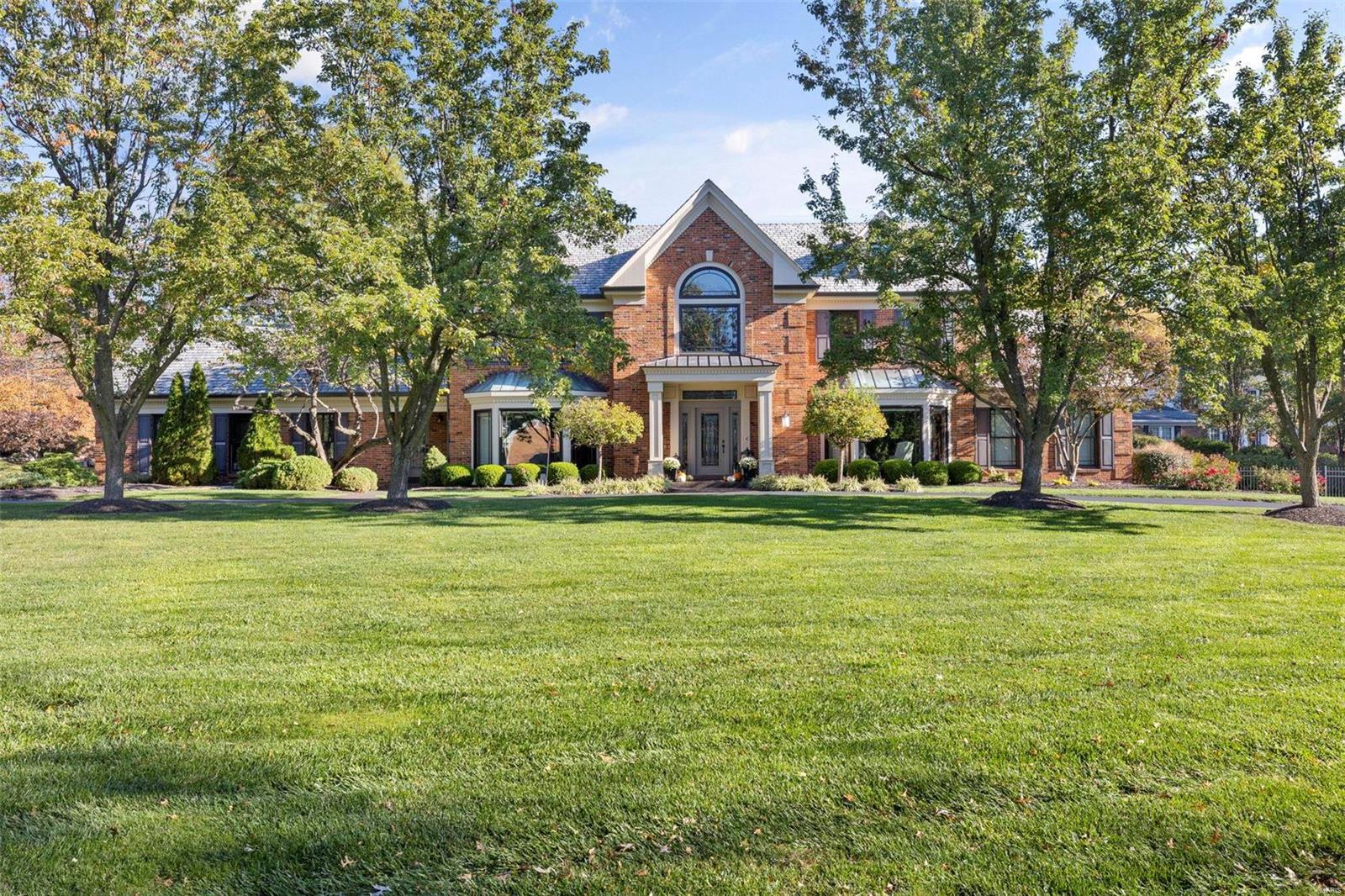 Welcome to this wonderful Frontenac home! As you walk in the door you are welcomed by the dramatic staircase in the entry foyer which opens to the dining room, a study with built-in bookcases & paneling & an open great room w/ detailed box ceiling. The eat-in kitchen has granite countertops, stainless appliances, & opens to the sunroom. Additionally there is a 4 season room which has a convenient pool bath and French doors which open to the covered porch & picturesque pool. The large primary suite has a walk-in closet & dynamite bathroom w/ floating vanities, smart mirrors, large walk in shower w/ dual heads & private water closet. Upstairs you'll find 3 additional bedrooms, 2 full baths, & a loft. The LL has a large rec room w built ins & bar, a 4th full bath, workout room, office & amazing storage including a cedar closet. This stunning home boasts a main floor laundry & a 3 car garage. Gorgeous corner lot with circular drive, pretty landscaping & gracious backyard. Wonderful value! Additional Rooms: Sun Room