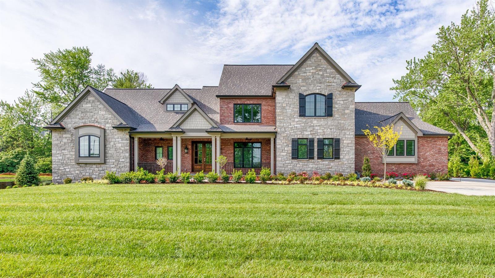 This spectacular 1.5-sty estate home from award-winning builder Mark S. Mehlman Homes redefines luxury living! Over 5800 sq ft of living space enhanced by soaring ceilings, arched entryways & rich hardwood flooring throughout the main floor. Expansive entry foyer leads to sophisticated dining room & stunning great room with dimensional ceiling, granite fireplace & double sliding glass doors to patio. Designer kitchen with 42” white cabinetry, commercial grade appliances, 10’x4’ center island & butler’s pantry adjoins light-filled breakfast room & vaulted hearth room highlighted by floor-to-ceiling stacked stone fireplace. Coffered master bedroom suite with marble bath with expanded shower & freestanding tub & adjacent study offers an appealing retreat. The 2nd floor extends the living quarters with 3 additional ensuite bedrooms. LL includes huge recreation room with wet bar plus 5th bedroom & full bath. Extensively landscaped 1+ acre lot with patio, grilling station & 3-car garage. Additional Rooms: Mud Room