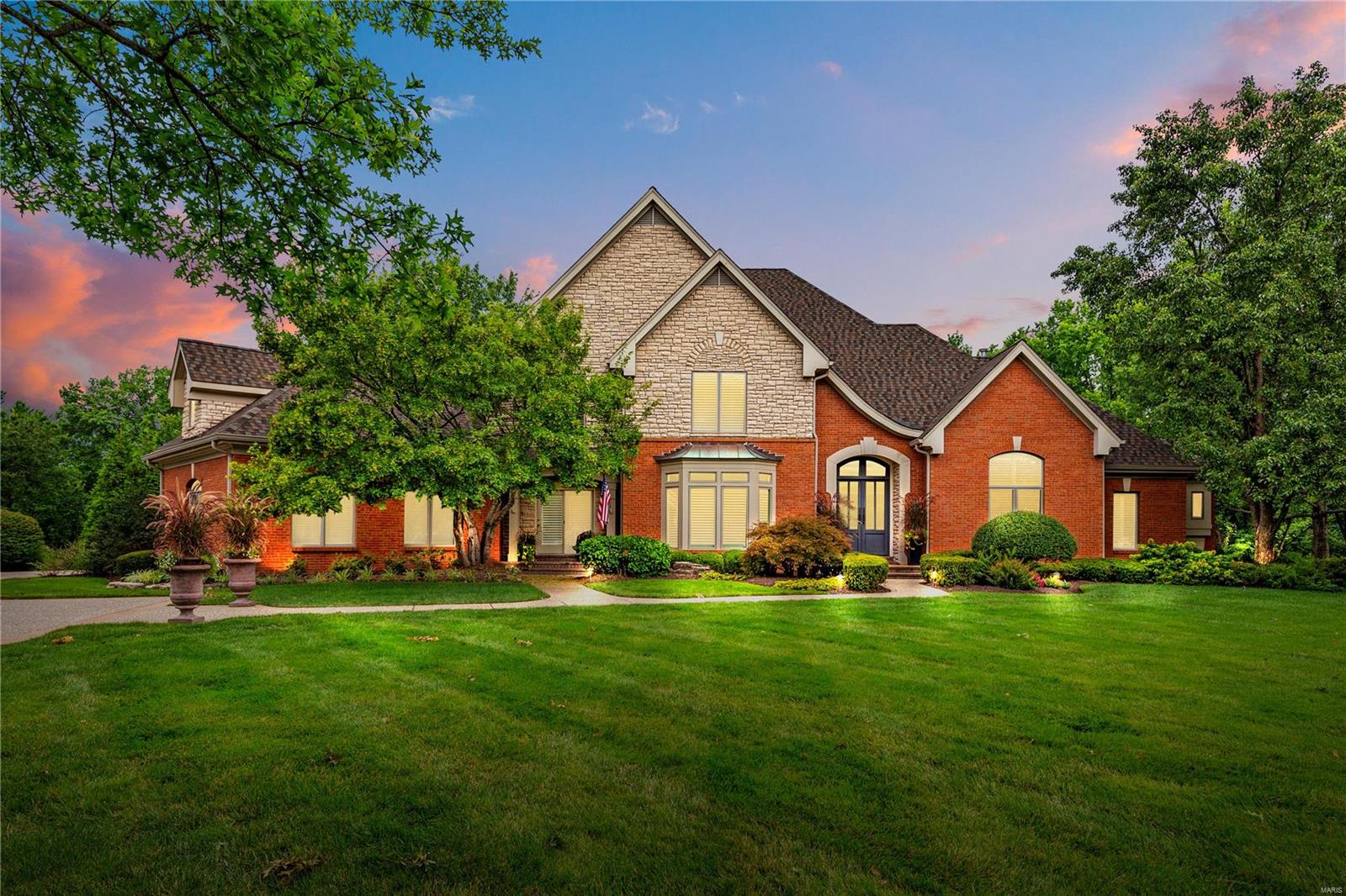 Quietly hidden in a gated community in the heart of Frontenac, discover this beautiful 1.5 story custom built estate. The grand foyer welcomes you, offering open views of all 3 of the home's levels. The main floor flows into custom kitchen and living spaces, which include a den, 3 seasons room, formal dining room, and hearth room- perfect for entertaining family and friends! Master suite features coffered ceilings, luxury shutters, balcony, and crown molding. Elegant, oversized bath boasts dual vanity, whirlpool, separate shower, and grand walk-in closet. Upstairs, you will find 2 generous ensuite bedrooms and bonus office with built in workspace. Spacious lower-level features full bar with Viking appliances, rec room, built in media area, 4th bedroom luxury suite, and floor to ceiling windows with unobstructed views of the outdoor patio and garden. Nestled on a 1-acre landscaped lot with quarried stone, fountain, 3 car garage, w/ room for a pool; this beautiful home is ready for you! Additional Rooms: Sun Room