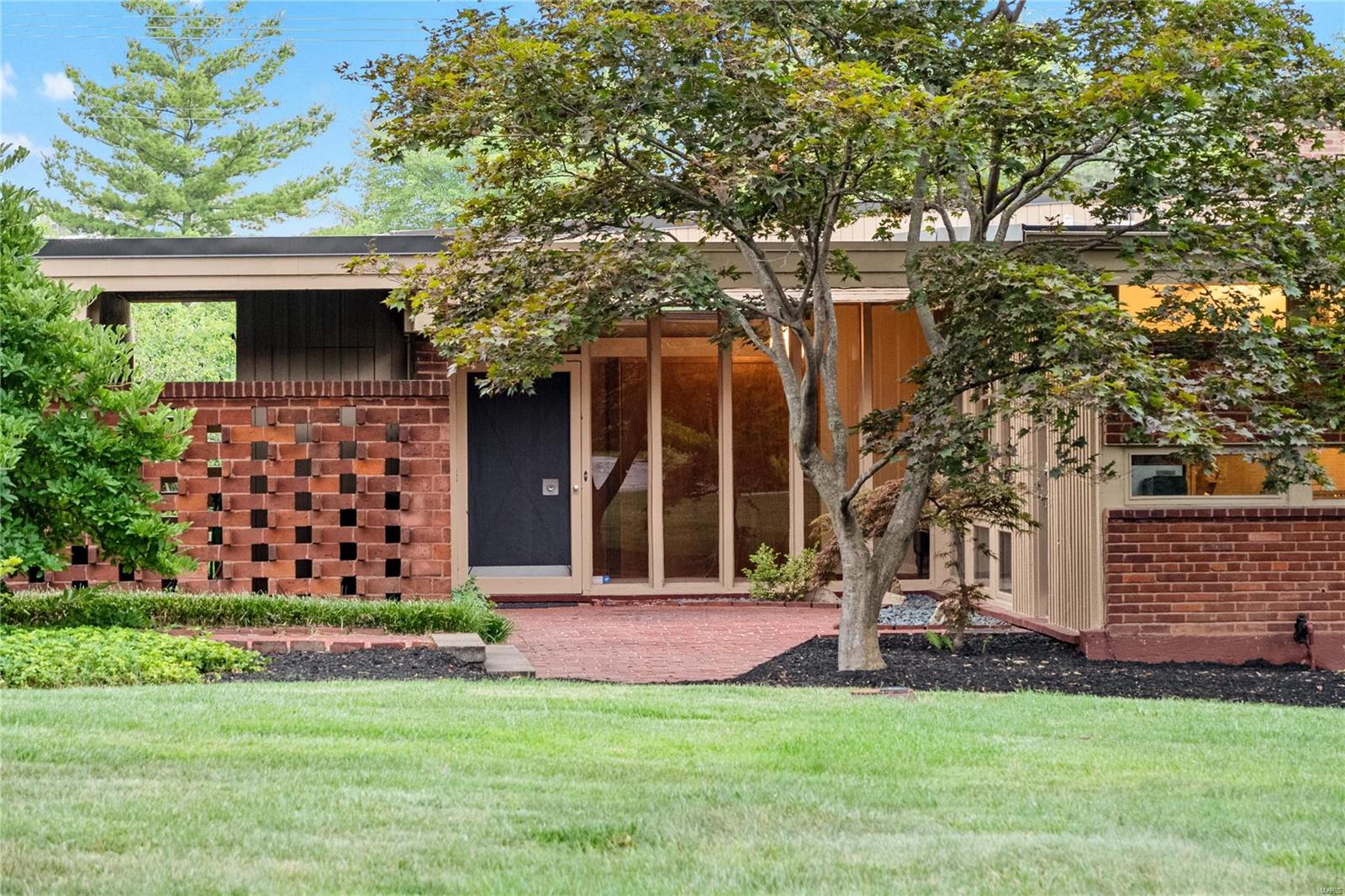 Rare opportunity to own an important mid-century home designed by Isadore Shank. Located close to Missouri Baptist and Mercy hospitals. The home is situated in the prestigious Westwood Country Club grounds. Homeowners can walk the grounds and enjoy the scenery. The house naturally connects to its’ serene gardens and gorgeous yard through its multiple floor to ceiling windows. Dramatic living room with vaulted ceiling, gas fireplace and a wall of windows that look out to the patio and private yard. 4 bedrooms & 3 full baths. The primary bedroom has an updated bathroom that leads to the private patio. Updated kitchen with newer appliances. Full basement with wine cellar and plenty of storage. 3-car carport. 1.2 acre lot with gorgeous gardens. New roof. Residents get a clicker for the Ballas Rd gate or can use the main club entrance on Conway. Parkway Central Schools. Additional Rooms: Wine Cellar