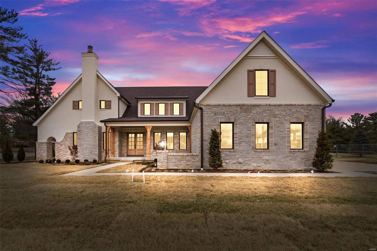 This stunning custom-built home by Boulevard Custom Homes is a true masterpiece. 1.5 story home w/ 6 bedrooms, 6.5 baths & 6665 sq. ft. of living space, this home offers the perfect blend of luxury & functionality. Luxurious 1st floor master bedroom suite features a fireplace, tray ceiling, "wet room" w/ tub & shower. 1st floor also offers in-law suite w/ private entrance. 2nd floor bedrooms are all spacious, each w/ their own private bathroom. Open floor plan w/ hardwood flooring, 12' beamed ceiling great room that is open to the gourmet kitchen complete with top of the line SS appliances, custom cabinetry, built-in ref., huge island w/ veggie sink, ice maker & walk-in pantry. Step outside to the spacious screened in porch w/ wood ceiling & fireplace, continue onto the patio w/ an outdoor grill station. Adjacent to kitchen is a butler's pantry/bar which flows to a formal dining room with dramatic wood ceiling. The home also features a large finished lower level w/bedroom, bath & bar. Additional Rooms: Mud Room, Sun Room