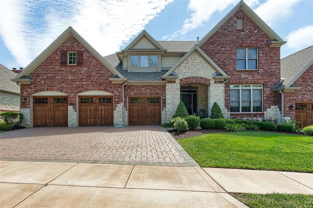Majestically backs to the 6th green at Meadowbrook Country Club golf course.. Fantastic view of the golf course and a lovely pond. Come and live the Meadowbrook lifestyle ! This beautiful home boasts a regal brick and stone front with paver driveway.  Exquisitely designed w/ warm oak hardwood flooring, crown molding, 10/12ft. ceilings, built-in book shelves & more! This home boasts over 4000+/- sf of total living space. Lovely foyer entrance leads into elegant DR. Greatroom features soaring ceilings, custom built-ins & gas F/P. Gourmet kitchen offers  granite, SS appl, 42” custom cabs, brkfst bar, butler’s pantry ,breakfast room  w/ access to the deck that looks out to the golf course. Master suite features lux mstr bth w/ double vanity, garden tub, sep shower & W/I custom closet.  Entertaining needs are easily met w/ a beautifully designed fin LL , w/ large family room, game room , wet bar, 4rd BR & full bth. Upstairs are two ensuite bedrooms/ full baths and loft office space. Location: End Unit