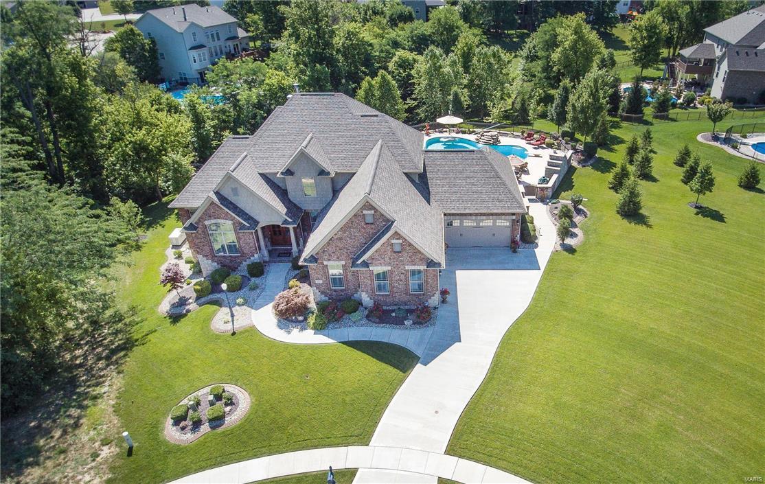 HONEY, LET'S STAY HOME!!  TOP SHELF FINISHES CREATE A LUXURIOUS "STAY-CATION".  If you are looking for mastery of craftsmanship along with fabulous amenities to cater to your dream home desires, than this one is for you!  At first sight, one can appreciate how the home is nestled on a stately, double cul-de-sac lot that is surrounded by an outdoor oasis like you have never seen before! The exterior is embellished with a lavish, awe-inspiring, gun-nite in-ground pool featuring a hot tub, custom lighting, fire-ovens, bathing patio's, a fire-pit & patio area & more. Take a drive at night to appreciate the dramatic up-lighting effects that highlight the landscape & details this spectacular home. That is just the exterior... the interior is sure to impress as no expenses were spared, no details were overlooked including a extra-posh wine cellar in lower level!. The features & amenities are just too numerous to mention; however, a complete list is available upon request.