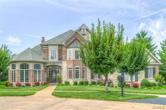 Stunning 1.5 Story Custom Johnson Built Home with elegant appointments throughout in quiet enclave of estate homes. The Private Walk out Extensively landscaped Lot has a breathtaking view of the Pool and Patio. This home has the feeling of Elegance tempered with simplicity from the built in bookcases, extensive millwork & custom upgrades.  Gourmet kitchen includes stainless steel appliances, gas cook top, granite countertops & large breakfast room opens to hearth room. Main Floor Master Suite has a luxury master bath. Upper Level has 3 bedrooms plus a private & jack n jill bath. The Exceptionally finished Lower Level has a Family/Media Room with walk in Wet Bar, Rec Rm, 5th Bedroom and Full Bath. Surround Sound on Main and Lower Levels have individual sound controls in most rooms.