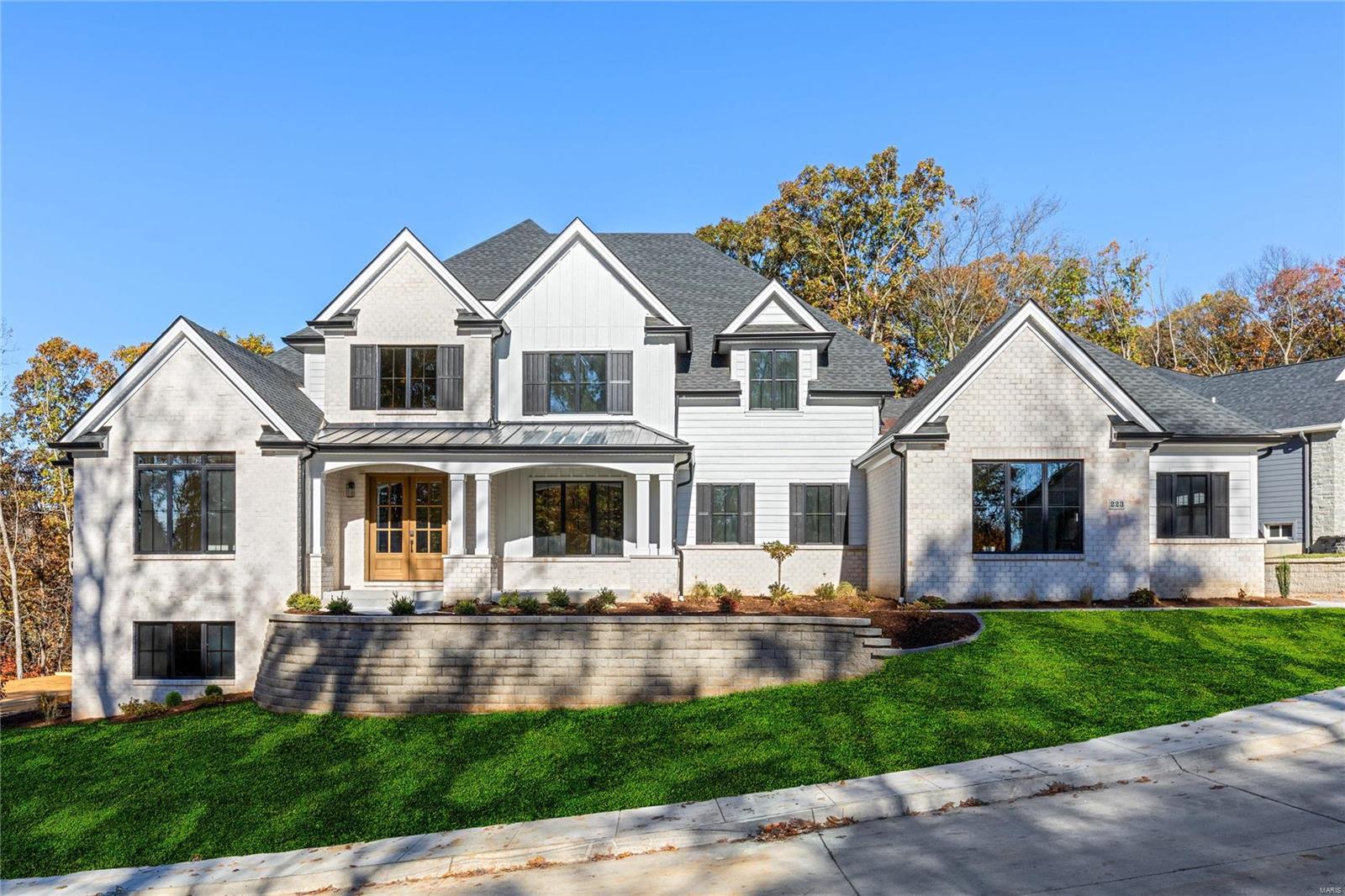 New construction in the newly developed Missouri Bluffs Community anchored by a championship 18-hole golf course. This spectacular brick 1.5 Sty from DH Custom Homes features extensive builder upgrades & custom amenities throughout including hardwood flooring, soaring ceilings & expansive windows. Impressive 2-sty foyer leads to private study, formal dining rm & stunning great rm with cathedral ceiling, fireplace & atrium doors that open to deck. Designer kitchen adjoins light-filled breakfast rm & hearth rm highlighted by floor-to-ceiling fireplace. Coffered primary bedrm suite with spa-like bath plus a generous-sized 2nd bedrm complete the main floor living quarters. Open staircase accesses 3 additional bedrms, 2 Jack n’ Jill baths & bonus rm. Premium cul-de-sac lot with open & covered decks & 3-car garage. Located just minutes from Busch Greenway & Chesterfield Valley with easy access to Hwys 40 & 94. Missouri Bluffs Golf Club is just a short walk or cart ride away. Dup of 24069043