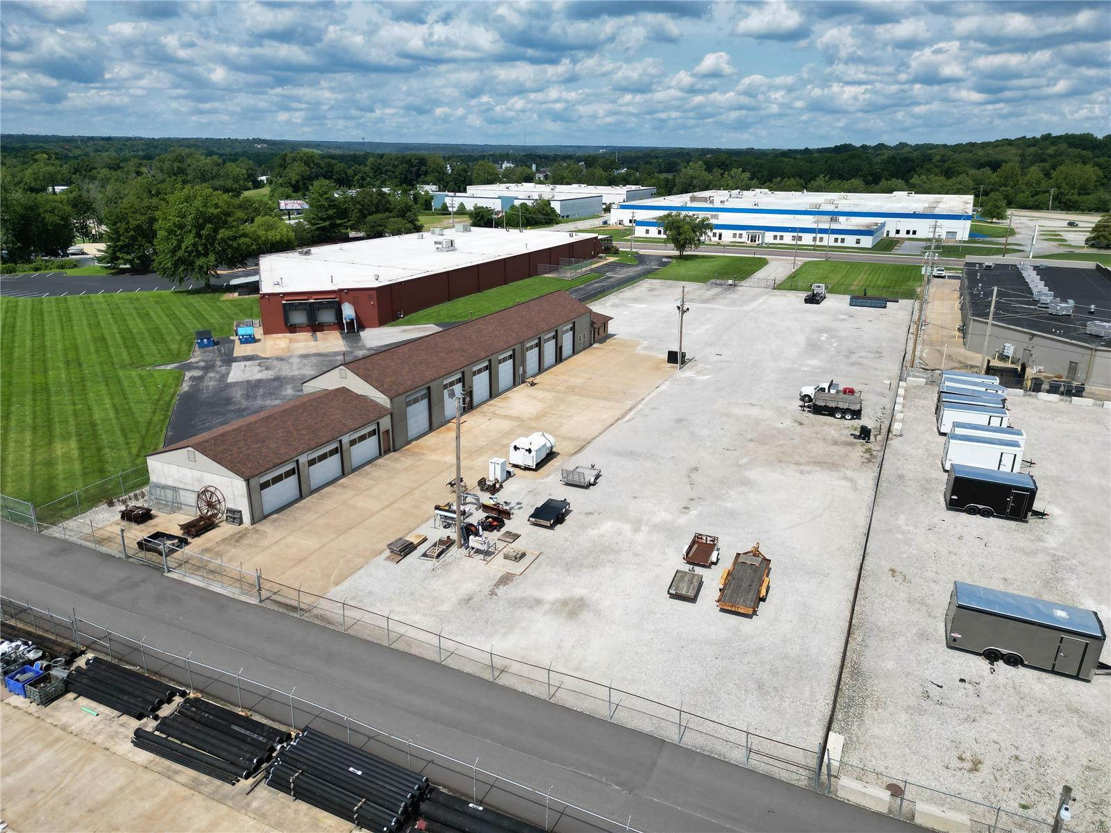 This two acre property is conveniently located in South County just minutes from I-55 corridor and the I-55/I-270 interchange, via Meramec Bottom Road, is available for sale. The two parcel site, one zoned industrial (M1) and the other zoned commercial (C8), offers a wide range of possibilities. As it sits, the site has most recently been used as a general contractors office and yard, with one 6,400 SF ten bay garage and office building. Seven of the garage doors measure 14'h x 12'w and three measure 10'h x 12'w. The yard, both concrete pad and gravel, is fully fenced, gated, and barbed wired. With 156' of frontage, the property has ample exposure to Lemay Ferry Road. (Sale includes 6210 & 6240 Lemay Ferry Road) Location: Industrial Area