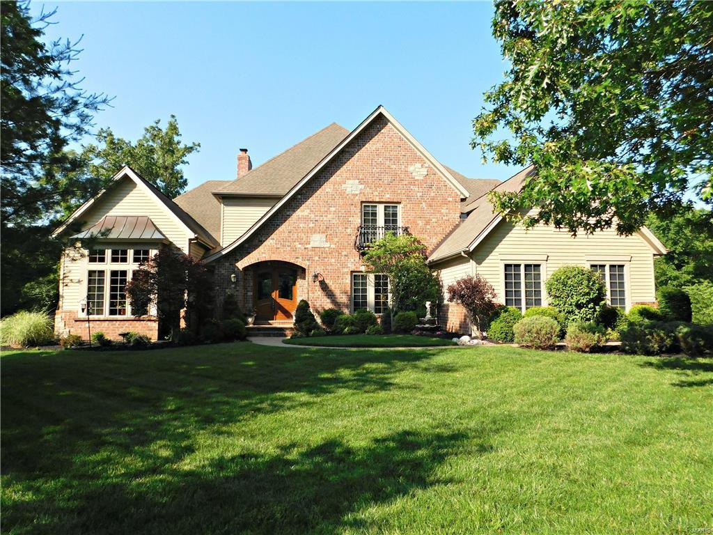 Stunning Fischer and Frichtel signature home on a private 2.37 acre lot! This meticulously maintained home is updated from top to bottom with quality finishes! There's crown moulding in almost every room, including bathrooms! Coffered and vaulted ceilings. 8 ft doors on the main level. Built-in shelving and special millwork. Every bedroom has its own ensuite bathroom and walk-in closet! You will fall in love with this open, spacious floor plan! There's a 2nd staircase to the upper level (pajama stairs). Main floor master bedroom with His and Hers sinks and 2 walk-in closets! The kitchen is open and inviting to the breakfast room and hearth room. There are 3 fireplaces throughout the home and 7 total walk-in closets! The finished basement is perfect for entertaining! The walk-out leads to a patio and private backyard! The deck is right off the breakfast room. Double insulated family room in the lower level is perfect for a theater room, music room, reading room, or secluded office!