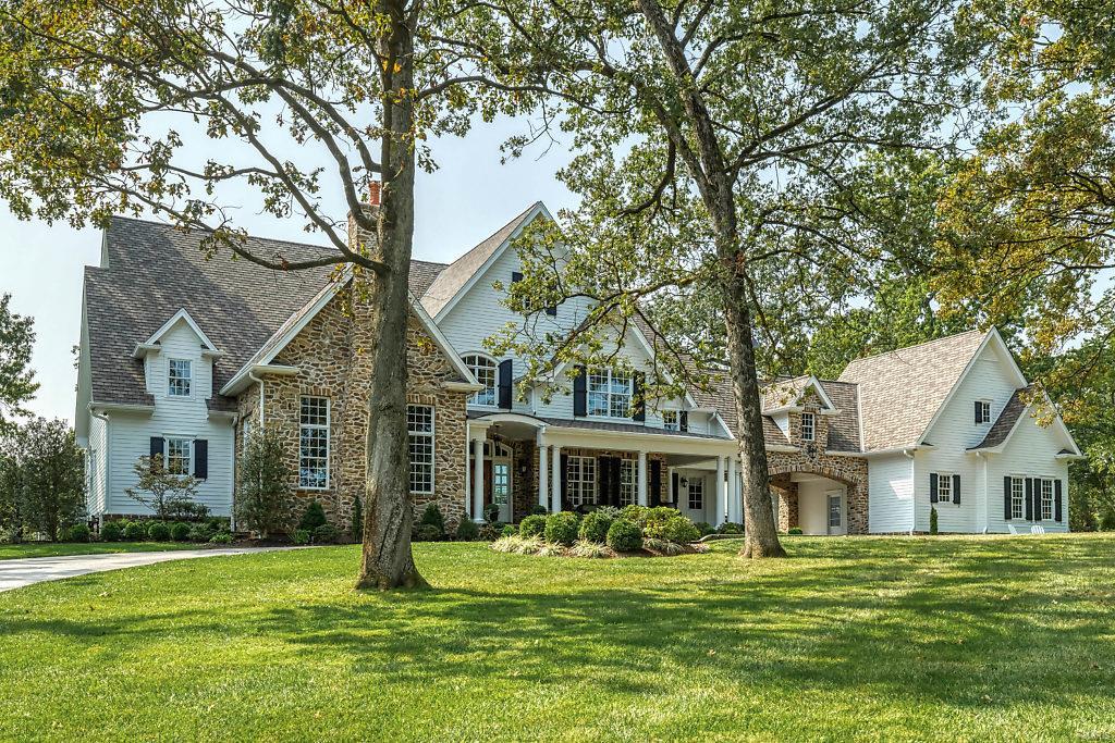 Magnificent 11,500 sf Maddock-built Estate home. Situated on a 1.8-ac lot overlooking the 1st hole on Old Warson Country Club golf course. Expansive entry foyer leads to vaulted study with wood beam trusses, granite fireplace & built-in bookcases, elegant dining room framed by arched entryways & spectacular great room with 11’ box beam ceiling, stone fireplace & architectural columns. State-of-the-art kitchen with marble countertops, commercial grade appliances & butler’s pantry adjoins light-filled breakfast room & vaulted hearth room with floor-to-ceiling fireplace. The master bedroom suite radiates warmth with a direct vent fireplace plus marble bath with free standing tub. Front & rear staircases access 5 additional bedroom suites, bonus room & 2nd floor laundry. Lower Level includes recreation room with fireplace & wet bar, game room, workout room, office & full bath. French doors open to outdoor living room with full-height fireplace & grilling station, resort style pool & spa.
