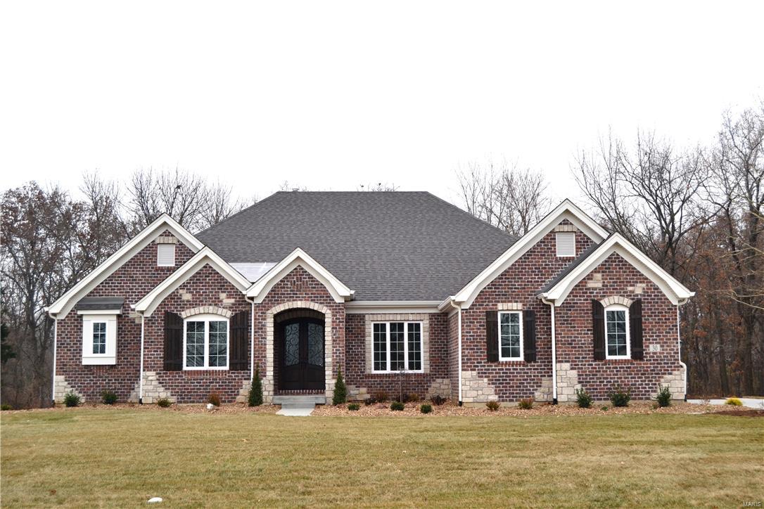Custom Home to be built in the incredible Meadowbrook Country Club Estates. The award winning Durham plan will be ideal on this home site. The front elevation featuring brick & stone, clad windows, color integrated concrete drive and landscaping is inviting. The partially finished walkout lower level features a high foundation pour, rec room, exercise room, wet bar, and full bath. The sprawling main floor includes; job finished hardwood plank floors, ceramic tile in the baths and laundry, luxurious master bath with granite vanity tops and walk-in shower plus a freestanding bath tub plus vanity with towers, gourmet kitchen offering granite countertops, KitchenAid appliances, stainless steel hood and large island, butler's pantry with custom finish, elegant moldings and custom built-ins, custom ceiling treatments throughout, outdoor living area features French coffered ceiling accessible to sun deck and outdoor fire pit. Features may be customized.
