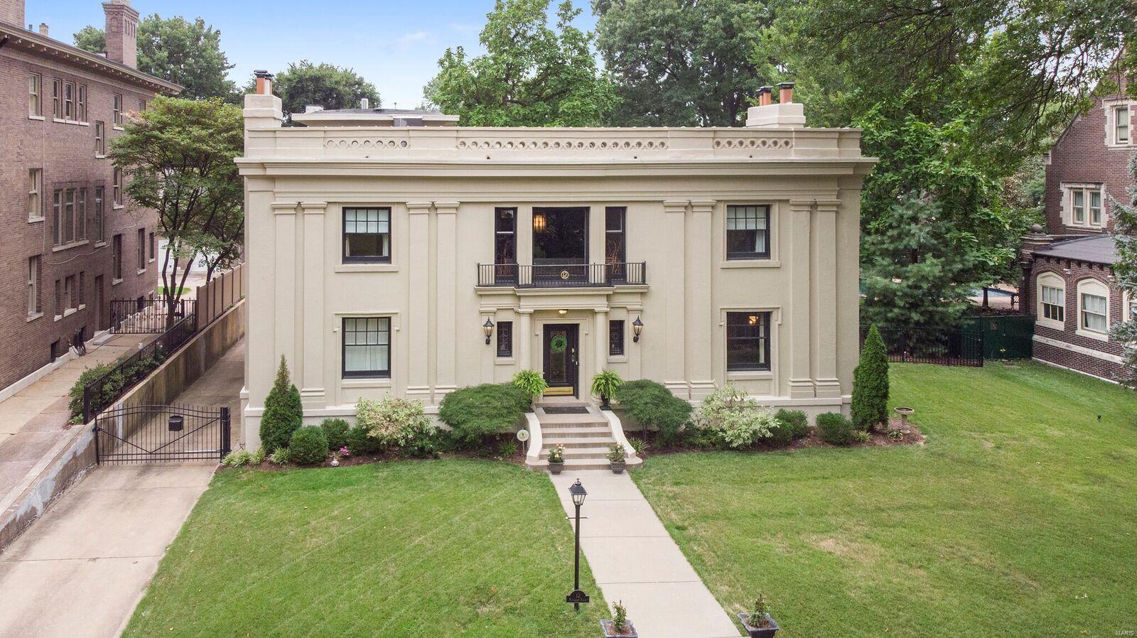 This amazingly beautiful home will captivate you! This park like neighborhood is just minutes from Forest Park, shopping and dining in the CWE. The entry way leads into the 2 story foyer that gives way to many of the rooms. The Parlor is the perfect place to entertain guests with the gas fireplace. Family room boasts double doors that open up to the deck and pool area. Dining room leads over to the original butler pantry. This opens up to the kitchen where you will find a mix of modern and 1920's charm. 2 bedrooms on the main level. 2nd floor shows off the library & 4 large bedrooms including the master & giant walk in closet with island addition. This walk in closet has a door that leads out to a veranda balcony. Laundry room on the 2nd level!! 3rd floor boasts an office/bedroom/rec room. Half bath & walk out to the flat roof that can be made into a rooftop garden. So much potential!! Very rare for this area, tuck under, attached 2 car garage.Motivated Seller.