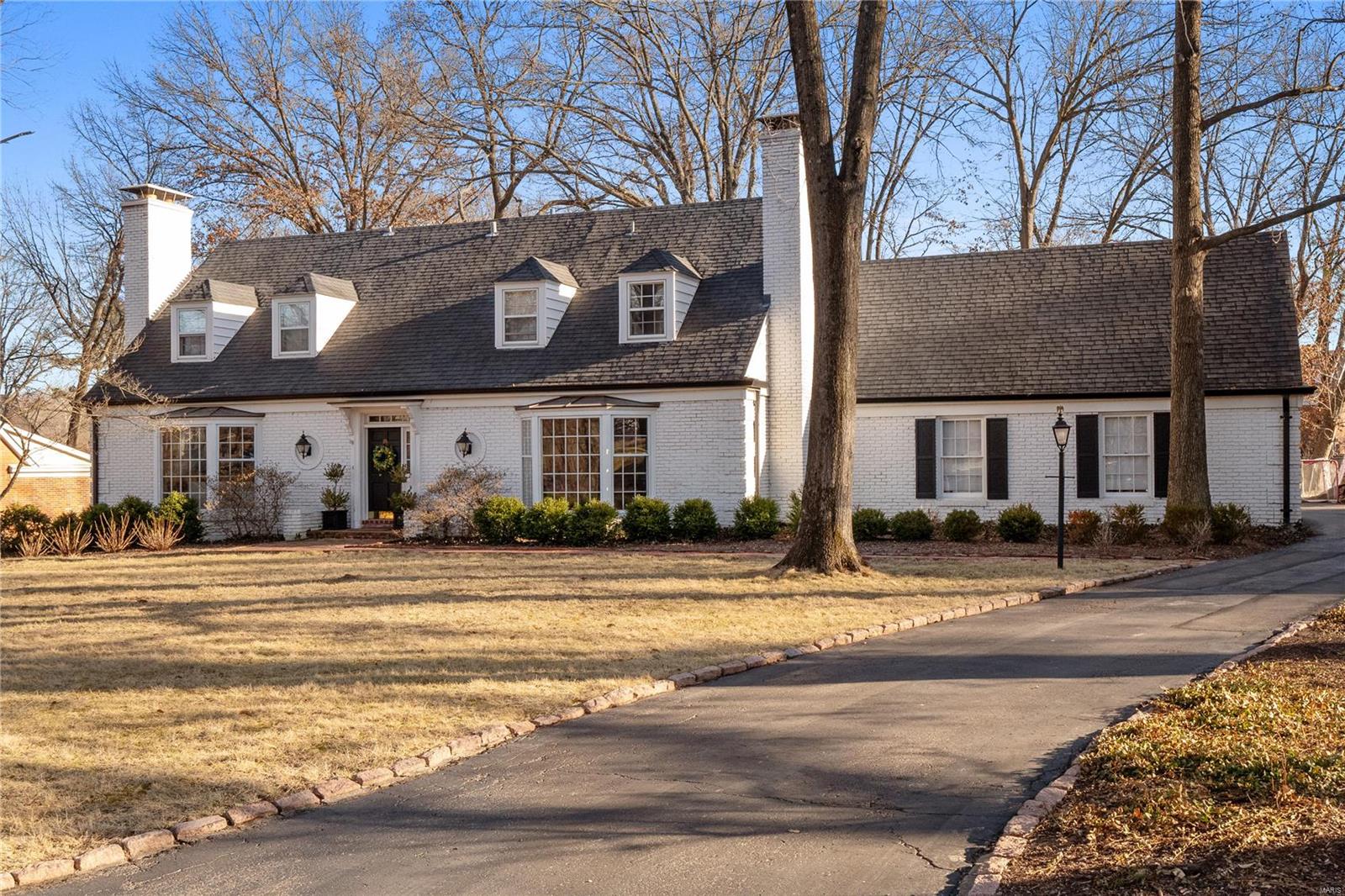 Beautifully appointed 1.5 story home in the wonderful Forest Green Estates of Ladue. The main floor features a bright & open floor plan w/ hardwood floors, big windows, wonderful moldings & built ins throughout. A chic entry hall welcomes you into a bright living rm w/ gas fireplace, & a sophisticated family rm w/ an additional gas fireplace. Gourmet eat-in kitchen is to die for w/ a center island open to a large family rm with stunning window wall views. The tucked away primary suite offers an oasis of privacy w/ an updated designer bathroom & walk-in closet.  Second floor boasts a large ensuite bedroom (second primary) & 3 additional bedrooms w/ an updated hall bath. The bonus basement features a custom wet bar w/ a beverage fridge & a rec rm for entertainment. You will love the walk-out terrace w/ a built-in FP overlooking the gorgeous private backyard. With a 2-car side-entry garage & Reed Elementary, this home is picture-perfect. Move right in and prepare to LOVE WHERE YOU LIVE!