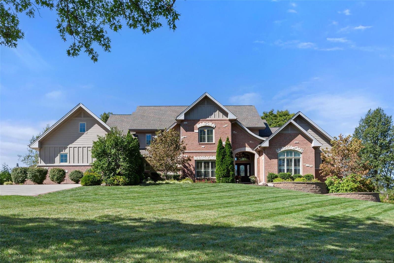 Welcome to this stunning and spacious energy efficient, smart home, situated on a sought-after street in the heart of Town and Country. This remarkable property features 5 en-suite bedrooms, including a main floor primary suite with a lavish bathroom and two expansive walk-in closets. Walking through the front door, you are greeted by a wall of windows that showcase a breathtaking view of the pool and the park-like setting in the backyard. The upper level offers 3 additional en-suite bedrooms and a versatile bonus room. The beautifully finished deep-pour basement is an entertainer’s dream, featuring a bar, movie theater, home gym, an additional en suite bedroom, and dedicated spaces for shuffleboard, a pool table, and a card table.The outdoor space is equally impressive, boasting a sparkling pool, a covered patio, and ample room for relaxation or entertaining.This extraordinary home offers the perfect blend of style, comfort, and innovation.