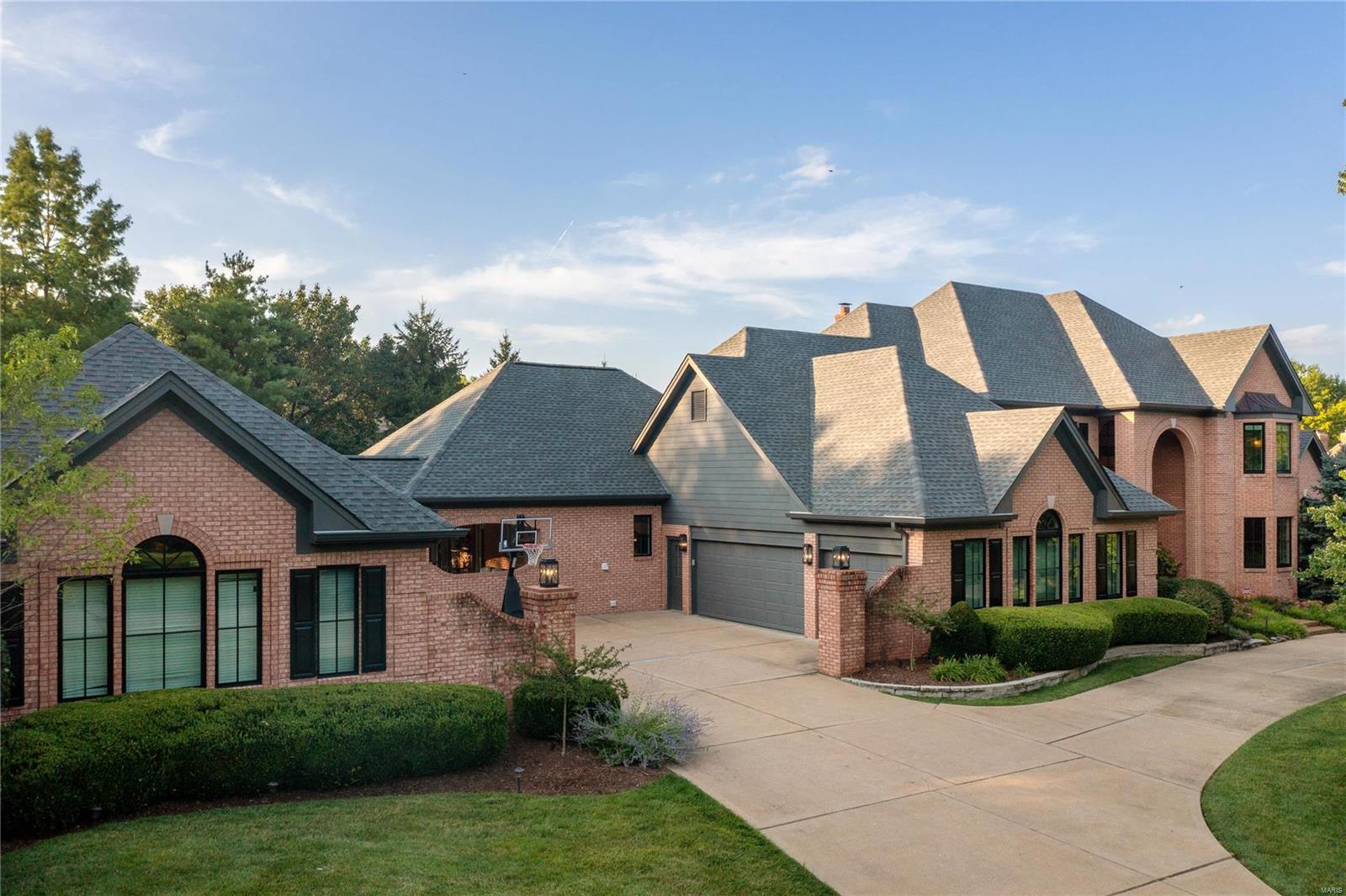 Spectacular 1.5 story on 1 acre...The impeccable grounds include a gorgeous pebble tec heated pool/hot tub, pond, new outdoor kitchen, multiple patios/entertaining spaces, & beautiful landscaping. Stunning 2-story entry opens to the spacious great room w/Palladian windows, brick FP, & wet bar. Paneled study w/built-ins, formal dining room w/exquisite woodwork & cove ceilings. Fabulous gourmet kitchen w/10 ft. center island, high-end appliances (Wolf, Sub-Zero, Bosch, Miele) open to light filled breakfast & hearth room (wood beam ceiling, stone FP) all walking out & views to the backyard oasis. Main floor ms suite w/FP, 2 walk-in closets & luxury bath. 3 ensuite upstairs brs w/loft. Fabulous walk-out fin. lower-level w/family room, full kitchen, wine room, game room, office, bedroom suite, workout room, & movie theatre. Six car-garage, new Pella windows, tons of storage & 19X12 ft. mn. fl. laundry room, surround sound in & out. Extraordinary! 2nd chance as 1st buyers had cold feet. Some Accessible Features Additional Rooms: Wine Cellar