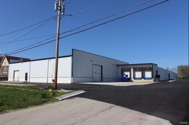 Extensive updates completed in this 34,000 sq.ft. building.  Great visibility from I-70/Entrance Ramp along North side.  Doors accessing all sides of the building. 4 Dock Doors, 2 "pickup height" Docks, 4 Drive-ins on the exterior.  1,300+/- sq. ft. of office space.  Multi-stall bathrooms on opposite ends of the building, and additional private office bath.  Fully air conditioned space, with New AC units installed throughout.  Potential for open work-space, manufacturing, conditioned storage...many options.  Taller ceilings in delivery bay area.  Divider wall with overhead door openings for potential division of space. Manager office overlooking warehouse/man./storage area.  Basement below front portion of building for additional storage.  Available for sale, or for lease.  Minimum 3-year lease terms to qualified tenants, at $4.60/sq.ft. modified gross. Location: City, Hwy/Interstate Frntg