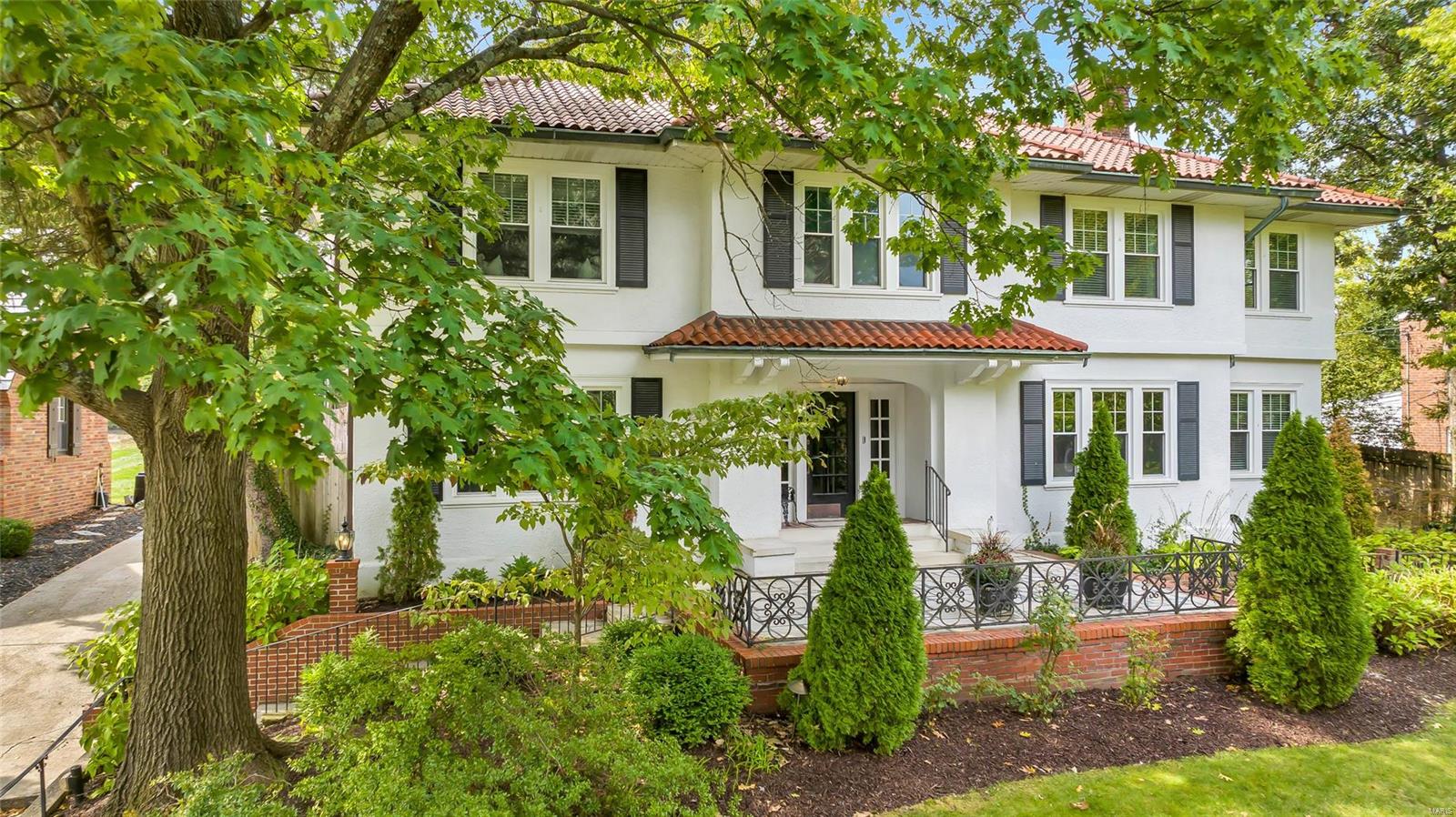 Nestled in the desired Sherwood Forest neighborhood of Webster Groves, this stately 2 story is the perfect blend of elegance, yet functional comfort & offers nearly 5000sqft of TLA. Beyond the flagstone patio, the stunning entry foyer is flanked by generously sized dining & living rooms. Gourmet kitchen w/ marble counters, center island, & walk-in panty seamlessly flow into a generous bkfst rm. Expansive family room add. has w/ built-ins, gas fp, & wet bar. Home office, laundry, mudroom & powder room will also be found on this incredible main floor. Access the 4 beds & 2 full bath on 2nd story, from the front or back staircases. Large primary BR has his & her walk-in closets & the stunning ensuite provides double vanity, soaking tub, & 5'x7'shower! Walkout LL offers even more space, w/ a rec room, full bath, & temp. controlled wine cellar. Outside, you can entertain or unwind on 1 of the 4 patios this home offers, one including a gas fire pit. Only minutes from all WG is so loved for! Additional Rooms: Mud Room, Wine Cellar