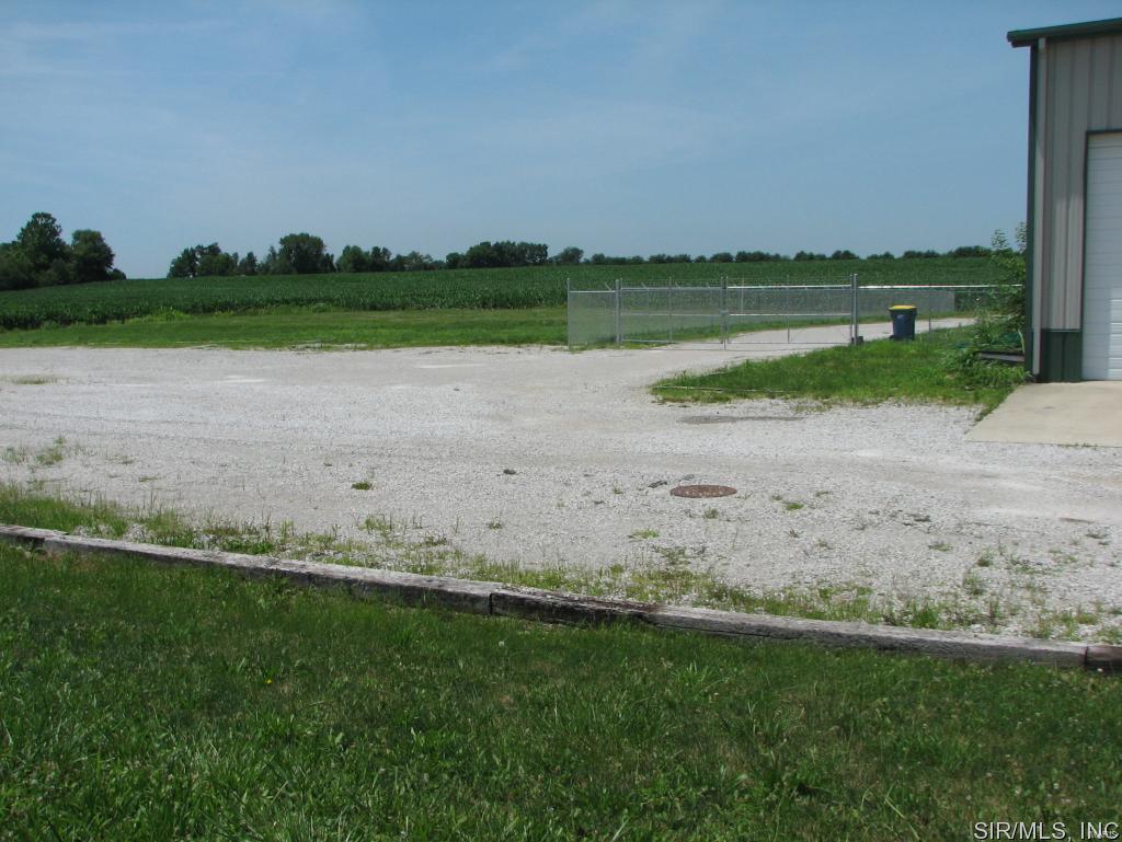 4517/4521 Hedge Rd ~ Three buildings with 23,500 sg ft of space on 4 acres of land with loading docs, a ramp, 14' doors, 23' ceilings, single phase 200 amp electric (three phase available at road), more than 4,000 sg ft of office space, ample restrooms, some paved parking and some rock parking, partially fenced. Before making an offer on any property, buyer should independently verify all MLS data, which is derived from various sources and not warranted as accurate.