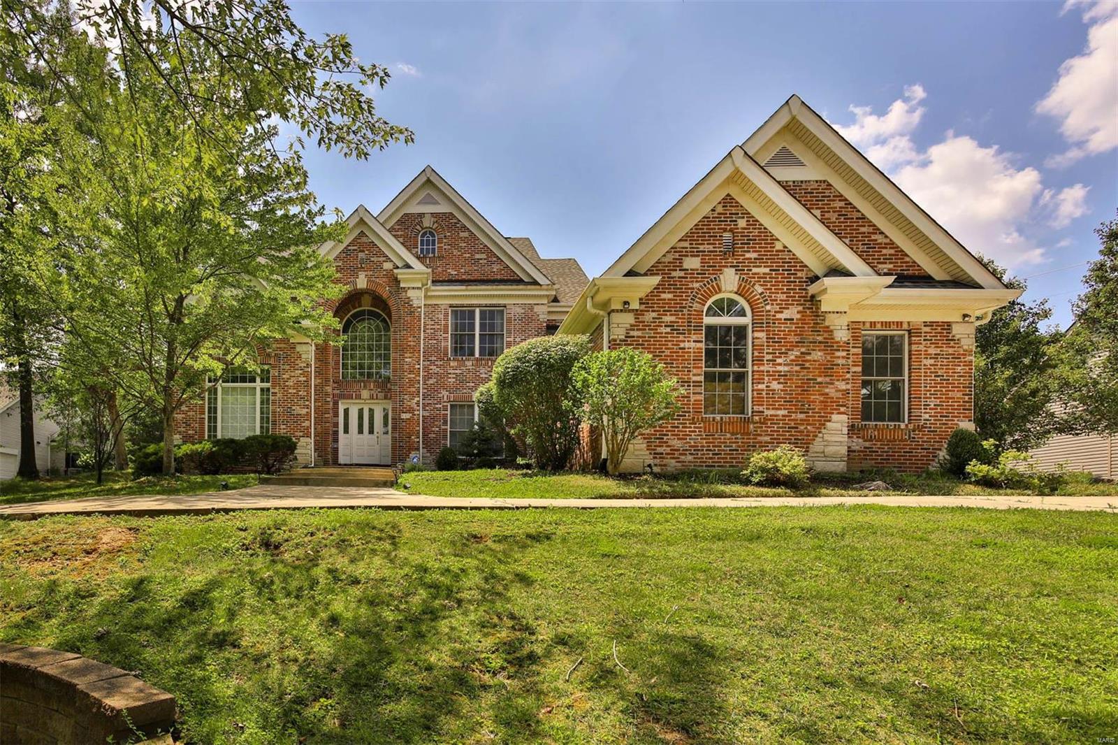 New Price! Tucked away in the Ladue school district, this gorgeous brick & stone front, 1.5 story home is sure to impress! Step inside and find a two-story entry leading into a beautiful office with french doors. Hardwoods on the main level span from room to room, creating an inviting atmosphere for entertaining & daily living. The Kitchen features a huge kitchen island, dbl ovens, ample storage space & even a breakfast room with a slider to the patio-perfect for summer barbecues! The main floor primary includes multi-level custom tray ceilings, plus an elegant primary bath with an oversized jetted tub, separate shower, and vanities. Upstairs you'll find 3 additional bedrooms with 2 full baths and a loft area ideal for family game nights or a homework/study space. Need more space? Check out the partially finished lower level, incl another family room, the 5th bed with an egress window. Don't forget about the pool-worthy backyard! Schedule your appointment today!