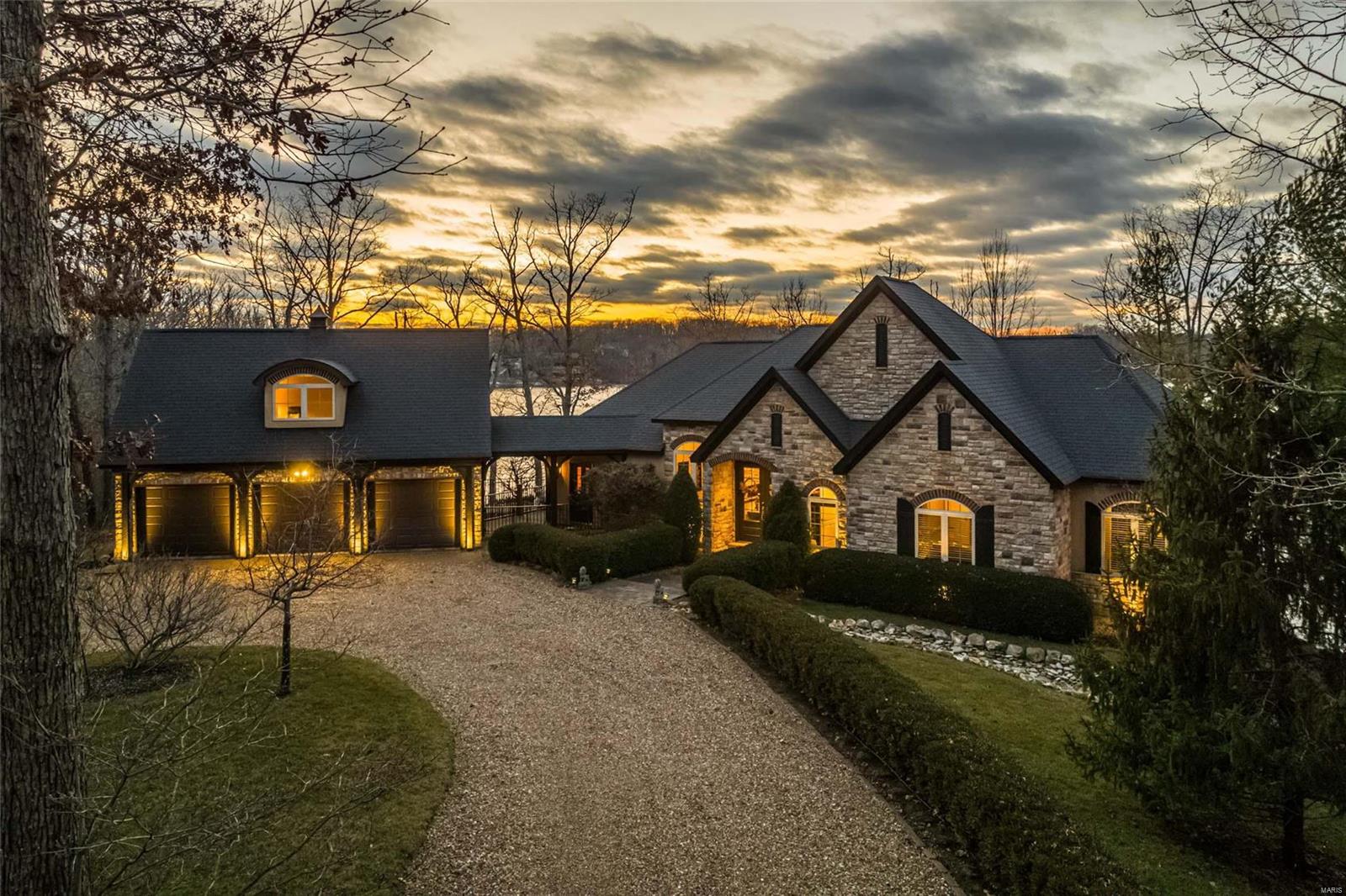 STUNNING "COTTAGE LIKE" HOME ON LAKE ALPINE WITH GORGEOUS VIEWS OF INNSBROOK'S PREMIER LAKE. This custom built 4-bedroom; 3-bath home's interior is as lovely as its curb appeal! The home has a gentle grade to the 314 feet of shoreline. The vaulted foyer opens to a great room with panoramic views of the lake, includes a stacked stone fireplace, open floor plan including the kitchen & dining area. The main level primary bedroom features a large bathroom with walk in shower, separate tub & walk in closet. The 2nd bedroom serves as a den/media room. There are 2 large patios on both the main and lower levels with gorgeous sunset views over the lake. The lower level includes a stone fireplace, family/rec room, bar, wine room & 2 private bedrooms & bath. Perfect for entertaining family & friends. The oversized 3 car garage includes a large light filled loft. Most furnishings, accessories, boat & golf cart, etc. included. Virtual Tour at https://my.matterport.com/show/?m=dED549gMdcp&mls=1 Additional Rooms: Mud Room, Wine Cellar